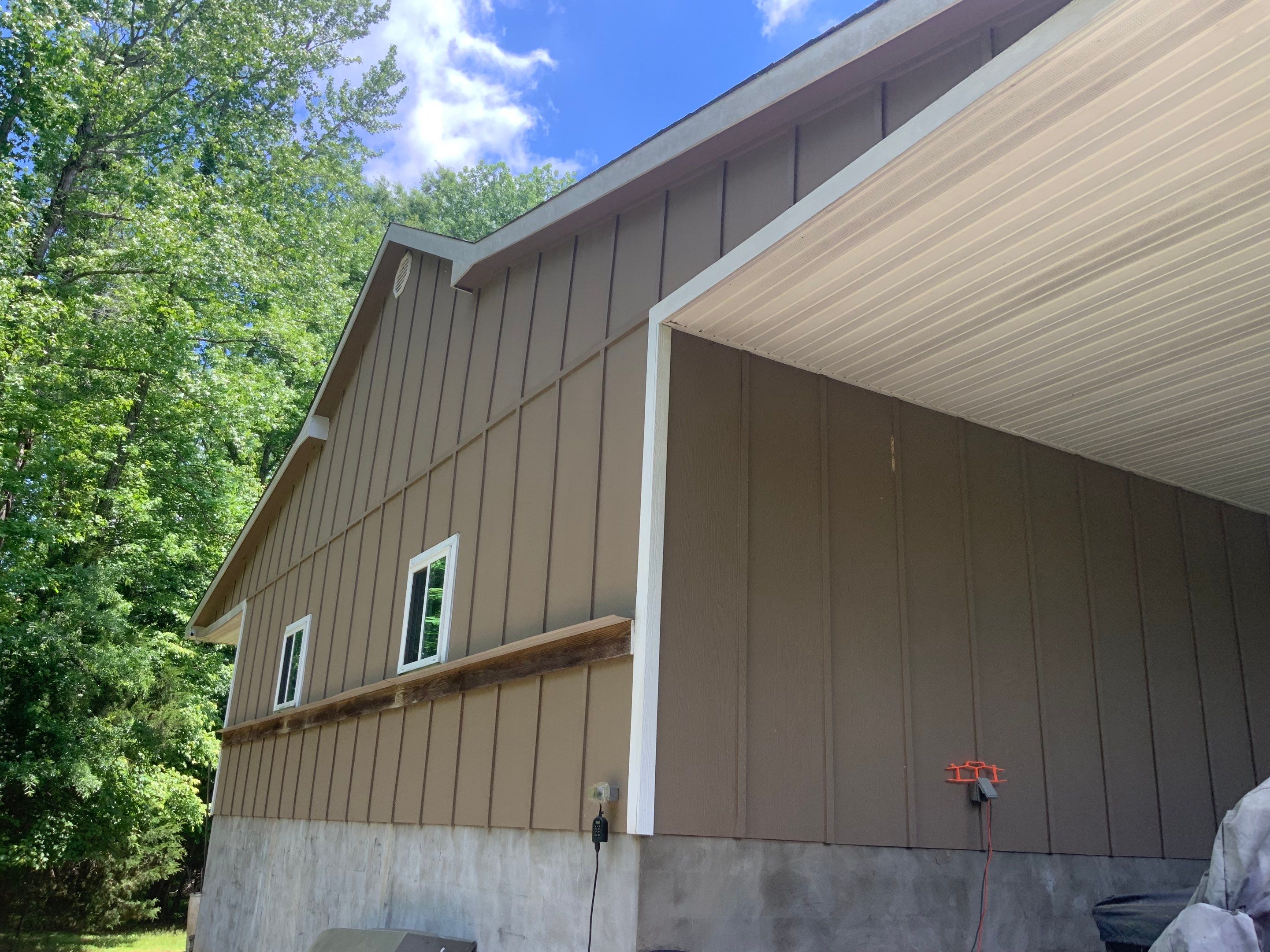 Siding replacement, exterior painting, and front door staining. by GonzalezPainters & Contractors Inc