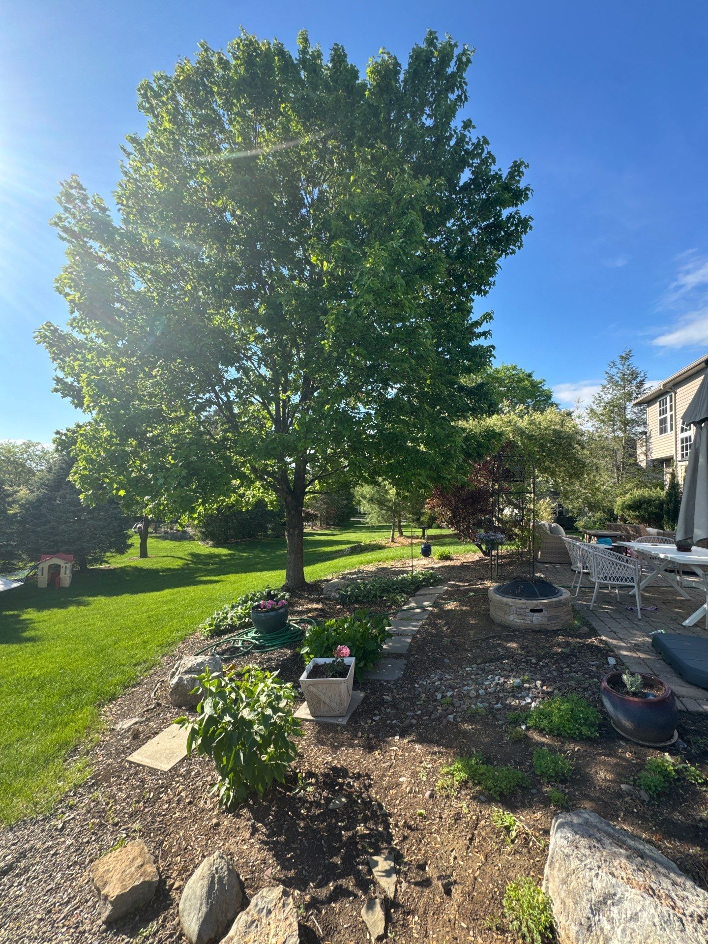 Backyard Retreat: Techo-Bloc Patio + Firepit Lounge by Saylor’s Lawn & Landscape