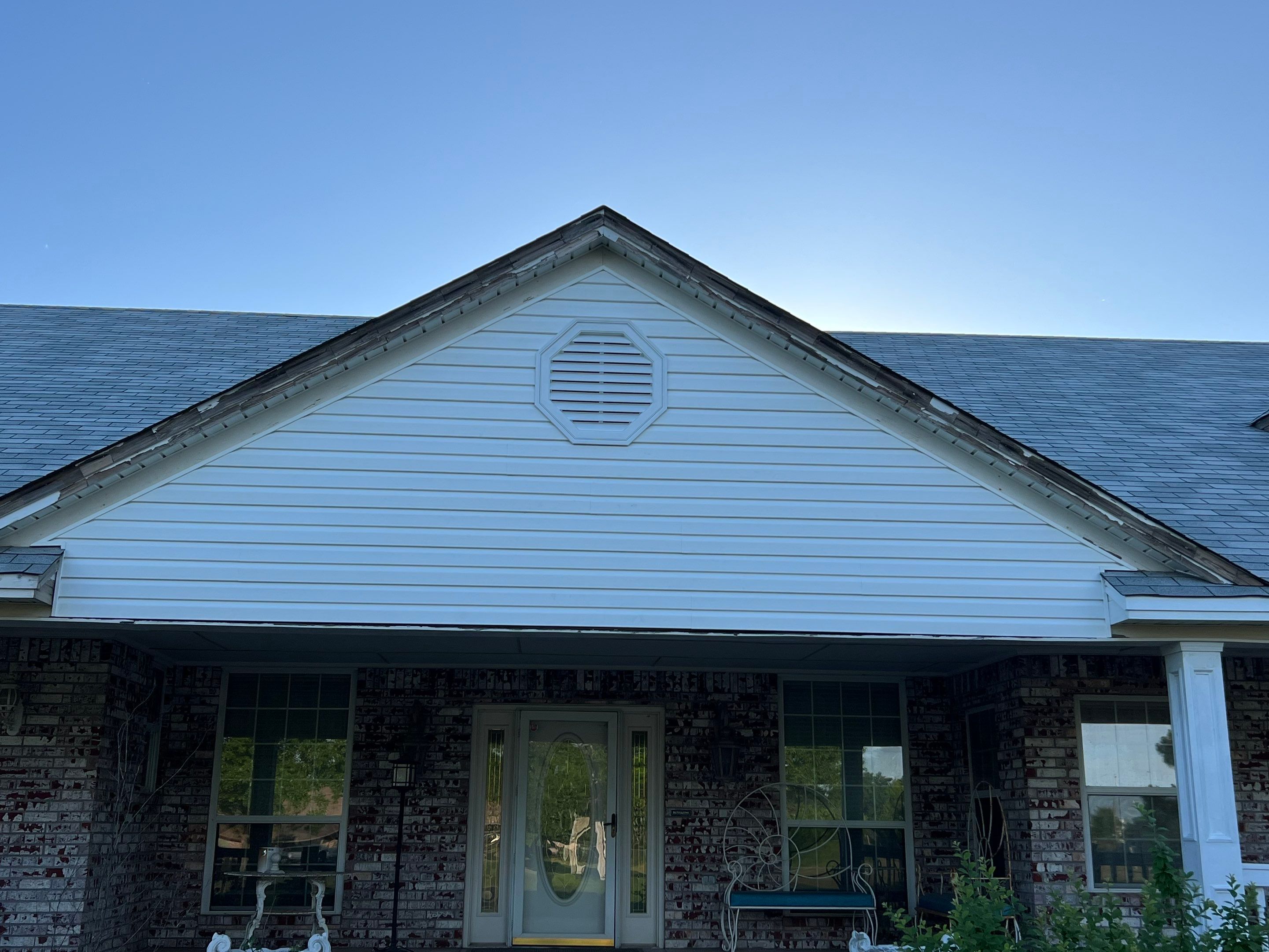 siding and porch railing replacement  in Yukon by McCann's Roofing and Construction