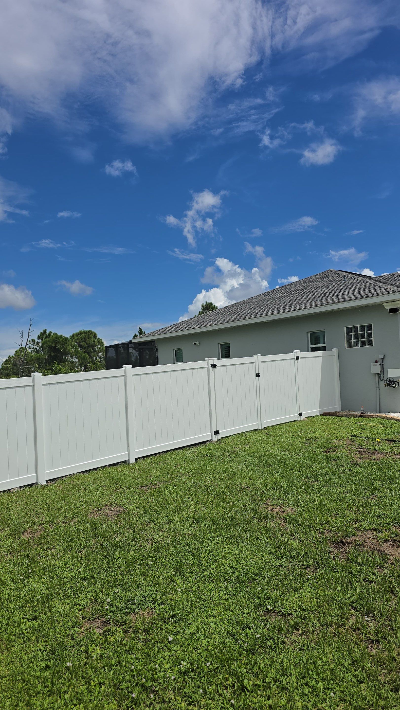 White Vinyl Privacy Fence Installation in Port Charlotte Florida by True Fence LLC