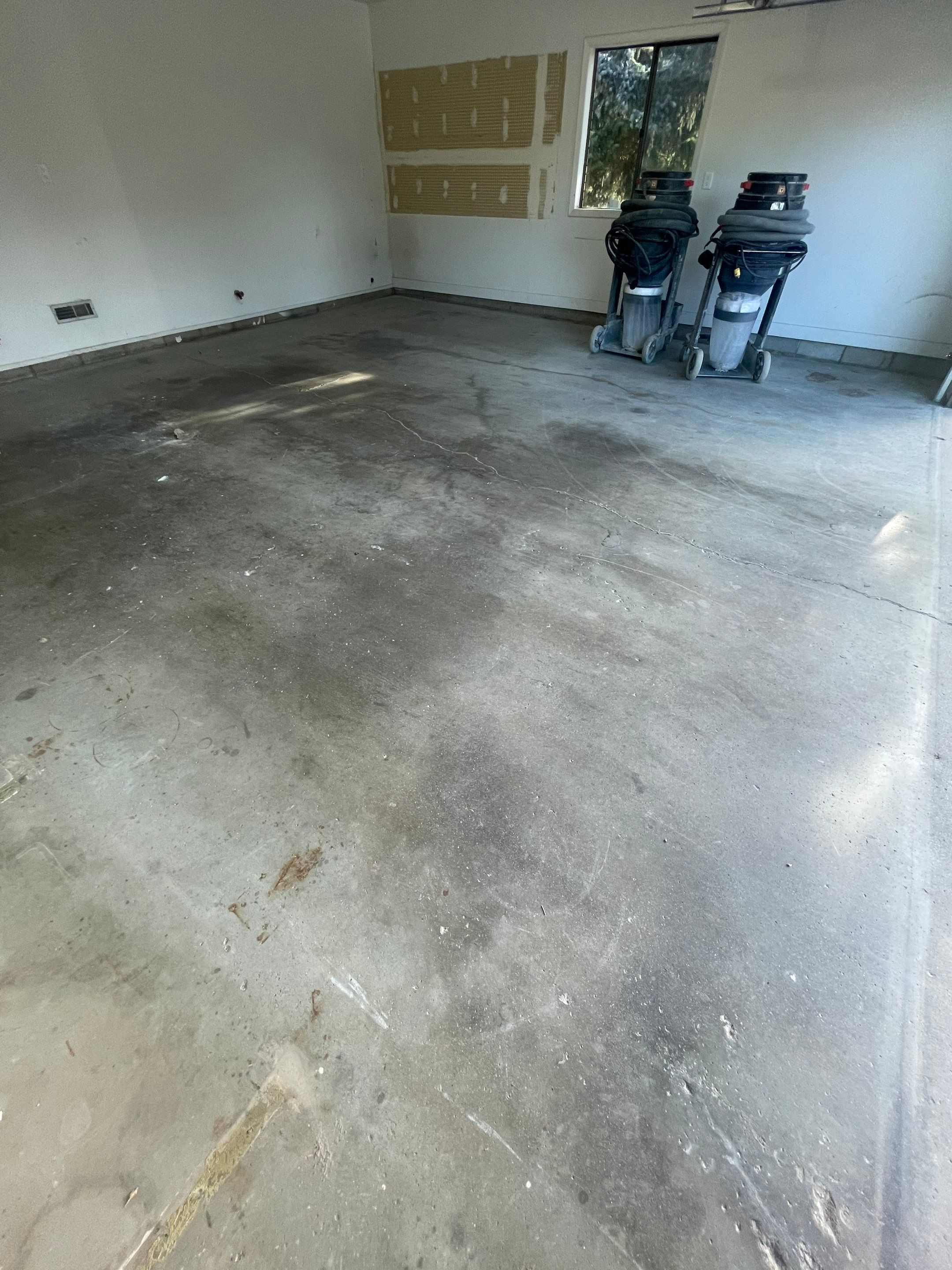 Grey Speckled Concrete Coating for Residential Garage in Yankton by Select Painting, Coatings & Garage Cabinets