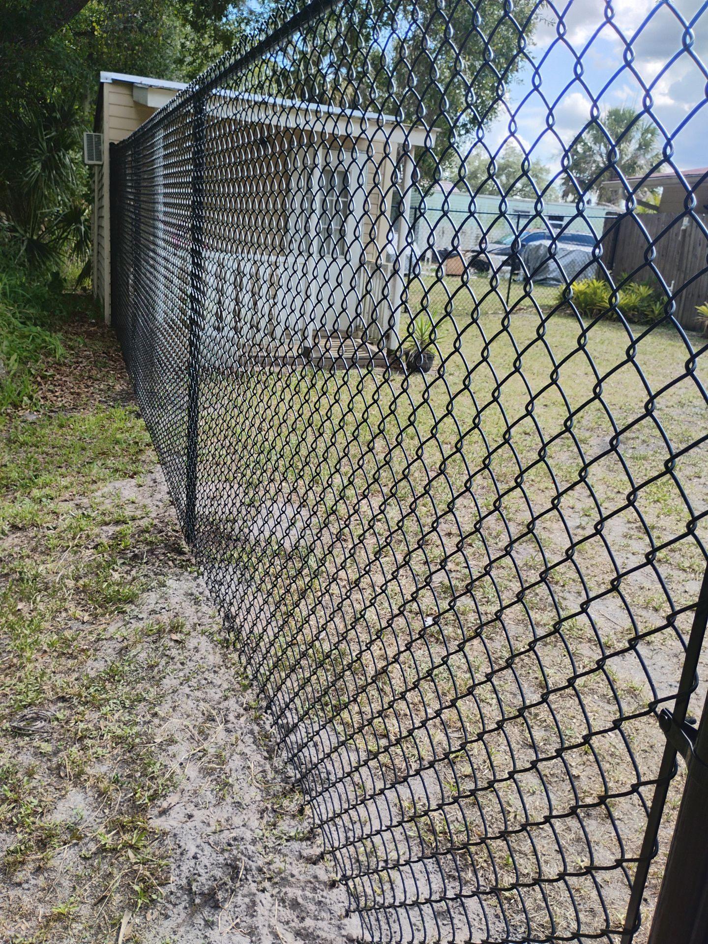 Black Vinyl Chain Link Fence Installation in Arcadia Florida by True Fence LLC