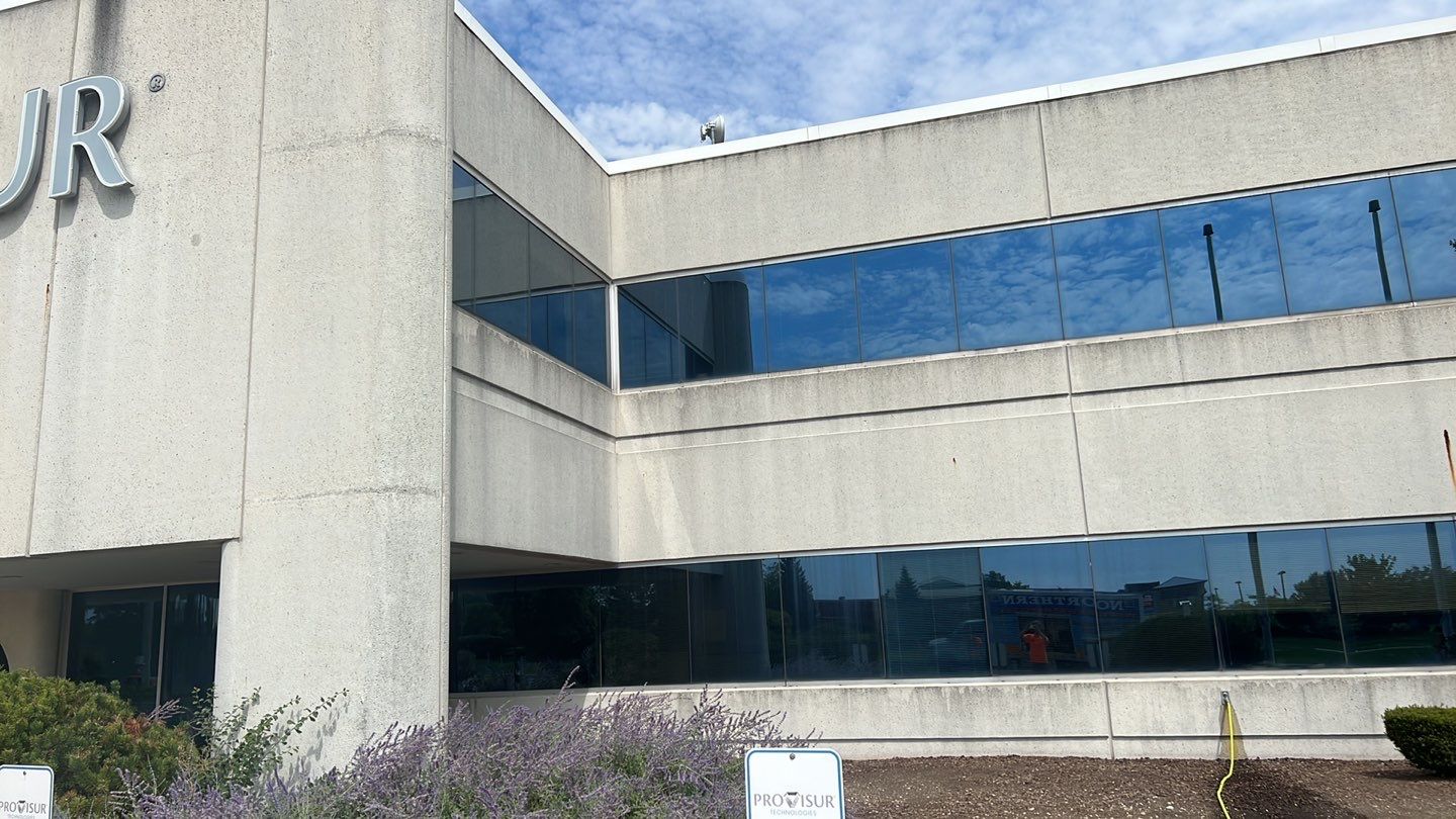 commercial pressure washing using Algaecide, soft wash soap by Northern Power Washing LLC.