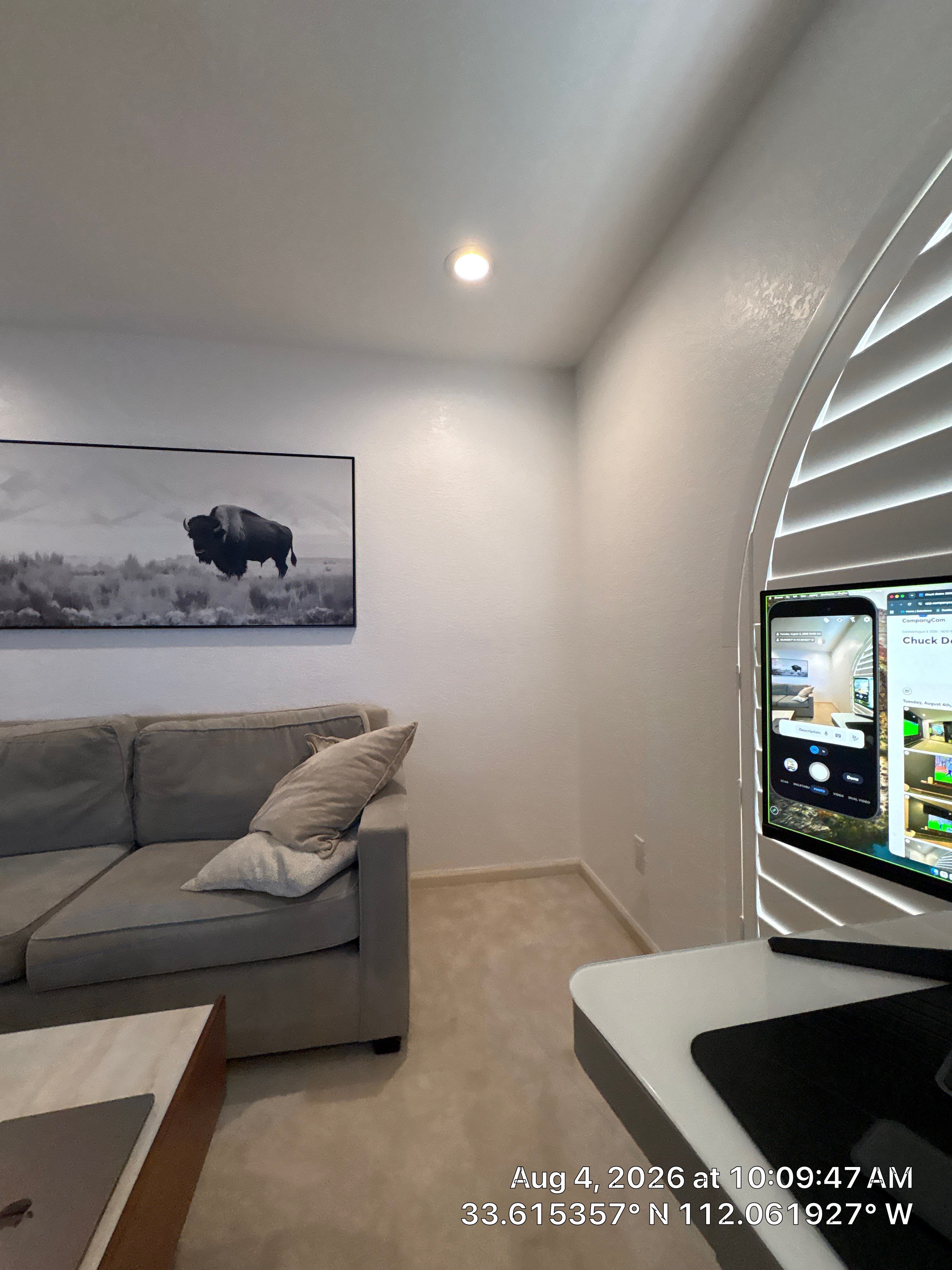 Custom Home Office Setup Featuring Arched Plantation Shutters and Accent Wall by CompanyCam Sales Demo