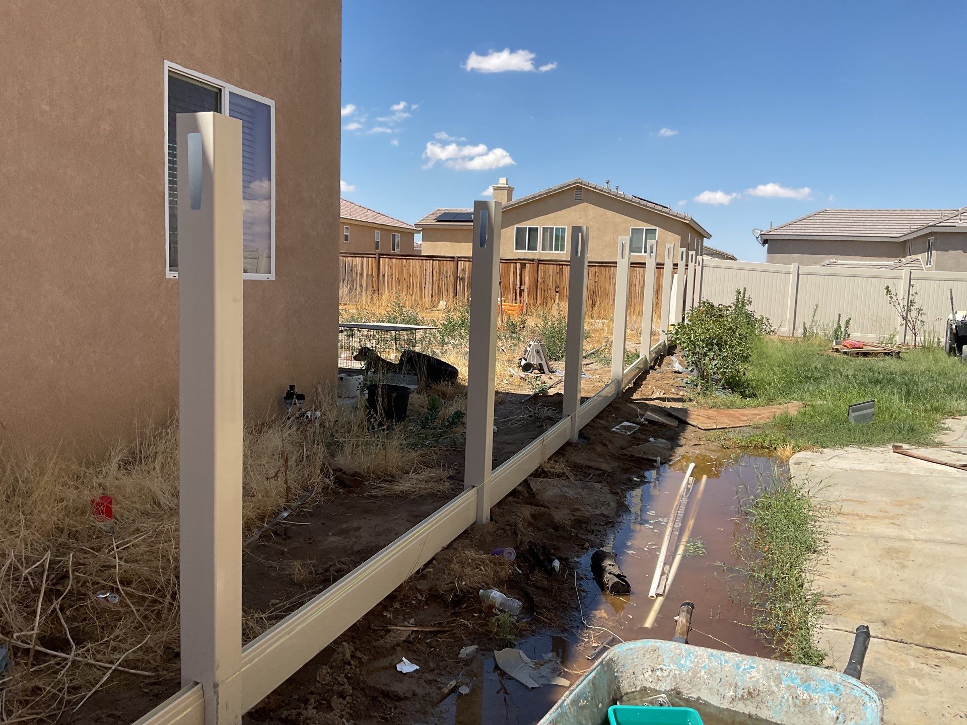 Tan Vinyl by Fence Guys Inc. 