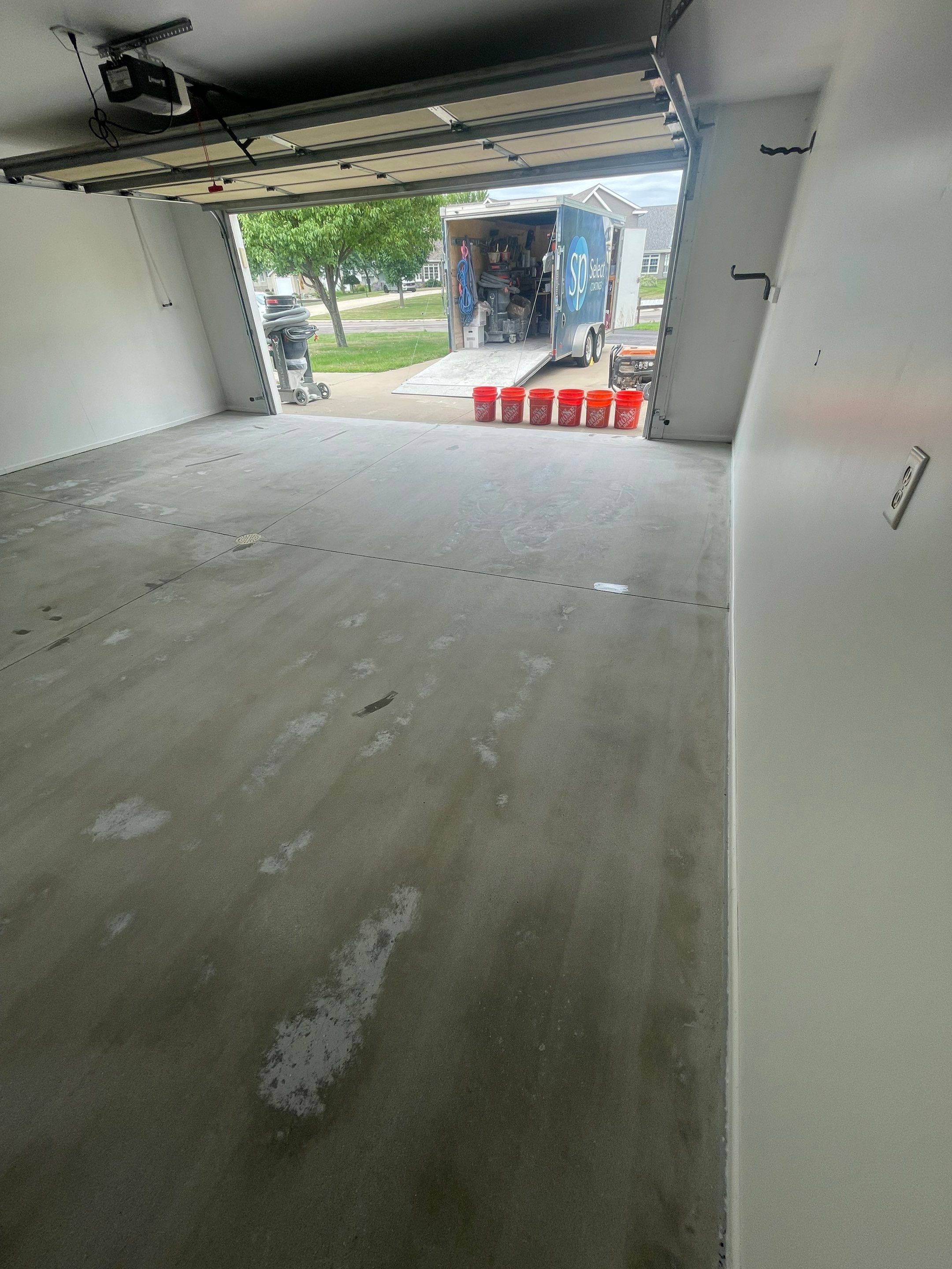 Coyote Flake Garage Floor Coating in Worthington, Minnesota by Select Painting, Coatings & Garage Cabinets
