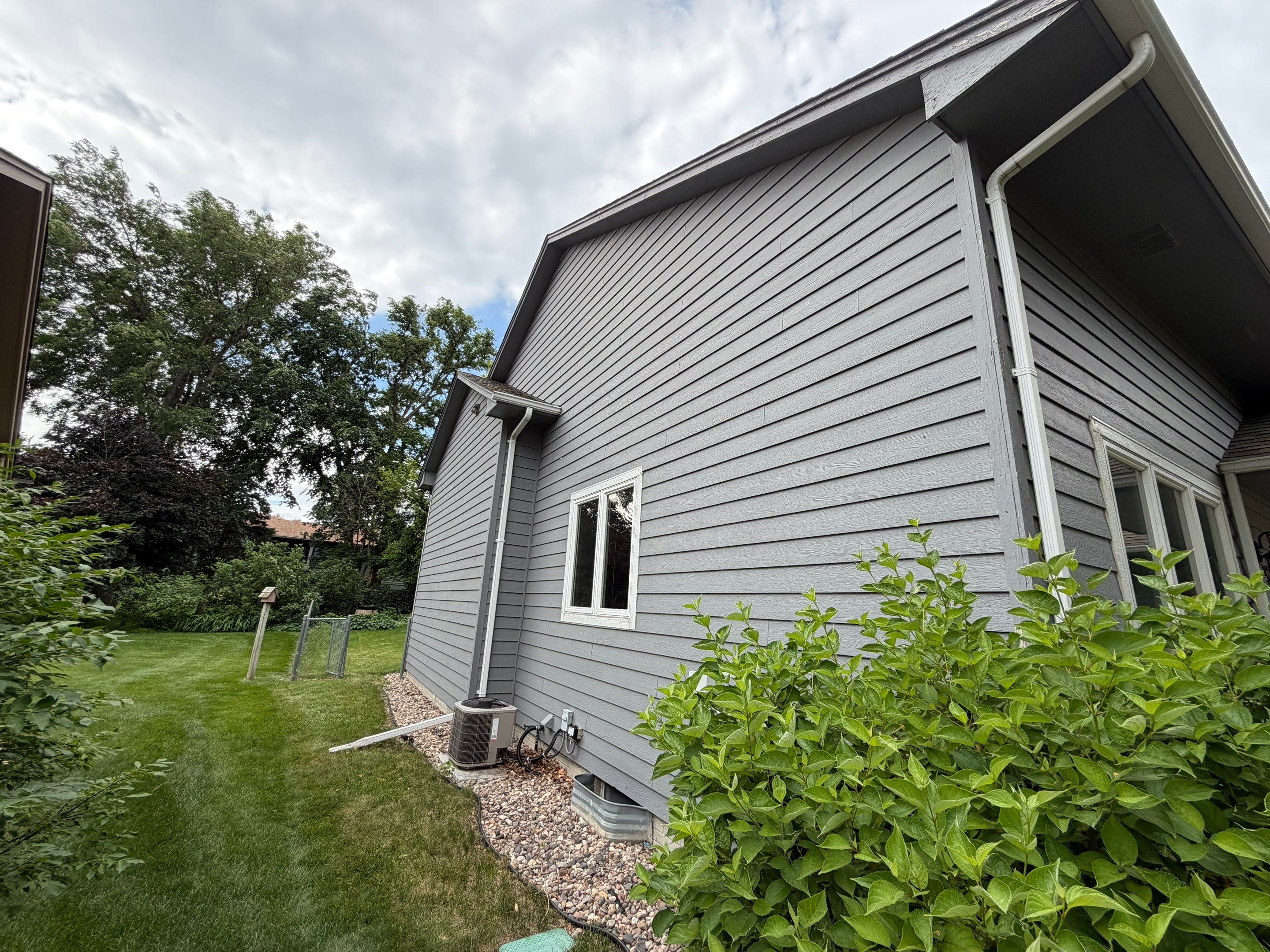 Full Exterior Painting for Gray Siding and Trim in Sioux Falls by Select Painting, Coatings & Garage Cabinets