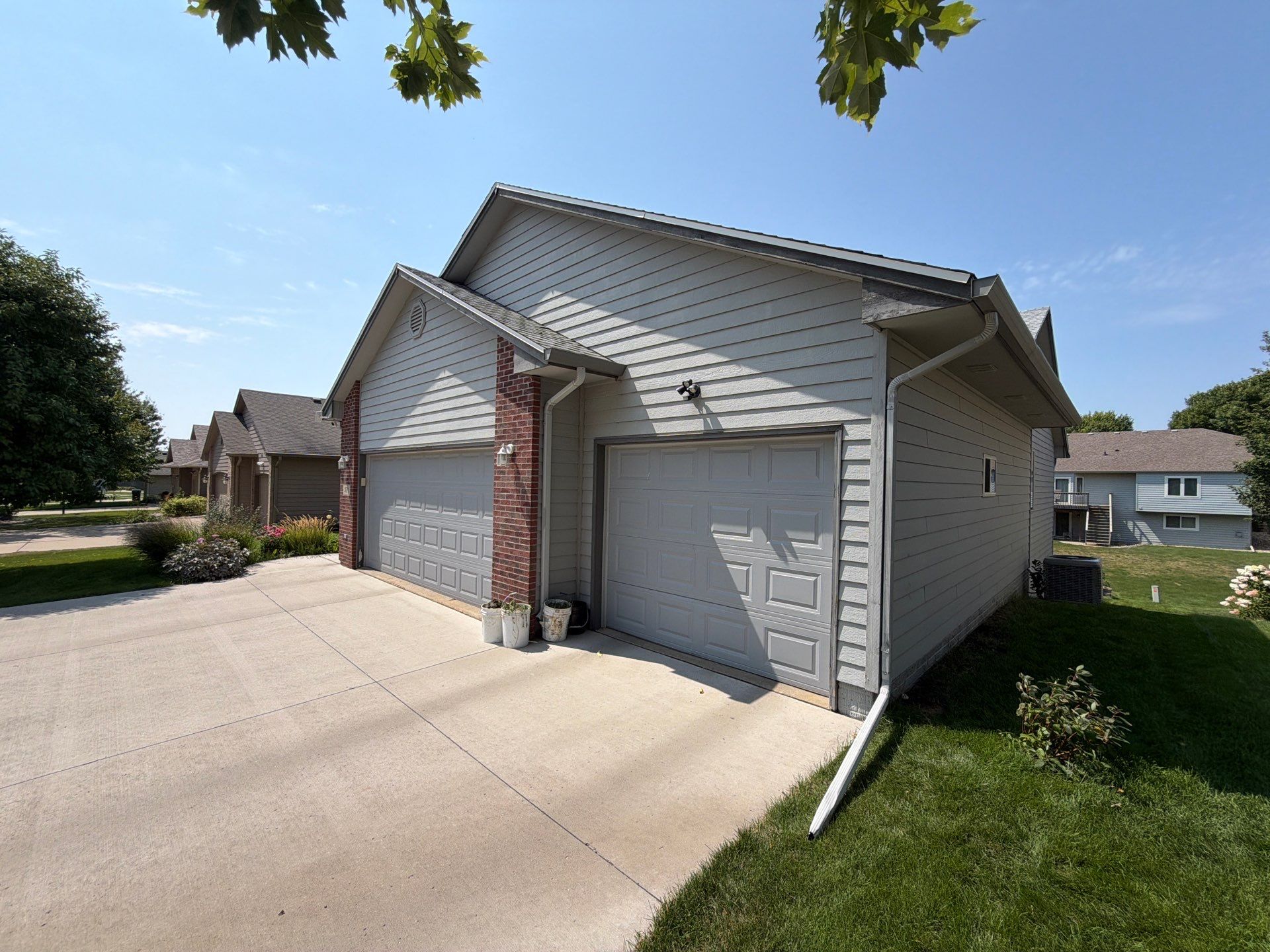 Exterior Painting for Vinyl Siding and Trim in Sioux Falls by Select Painting, Coatings & Garage Cabinets