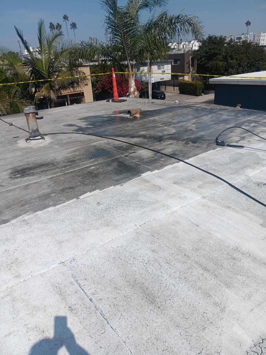 Commercial Roofing Installation using Silicone Coating by Hull Brothers Roofing