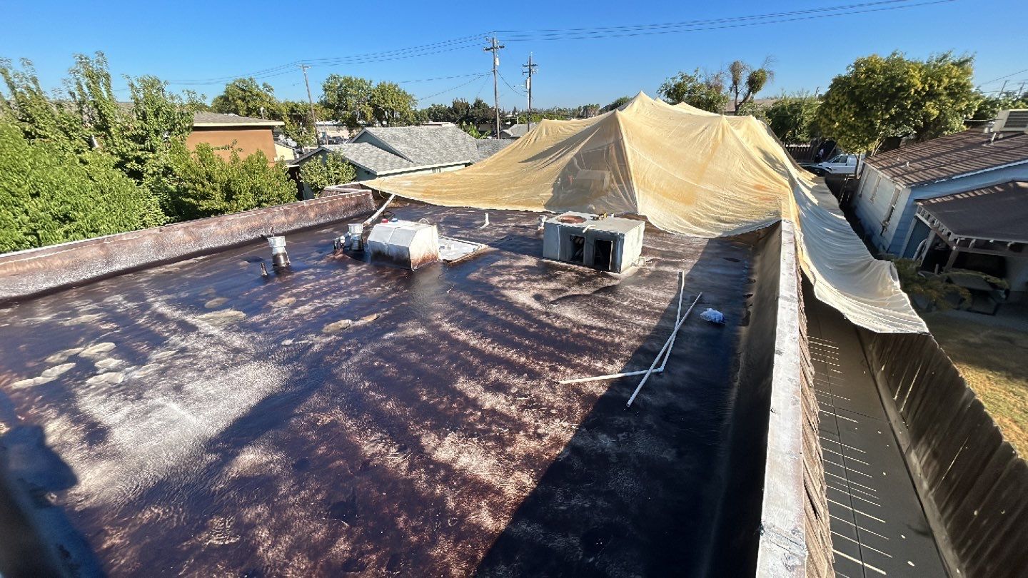 Foam Refurbish using Conklin Benchmark/PUMA XL coatings and spray foam; Also metal roofing around parapet wall by Straight Edge Roofing Inc