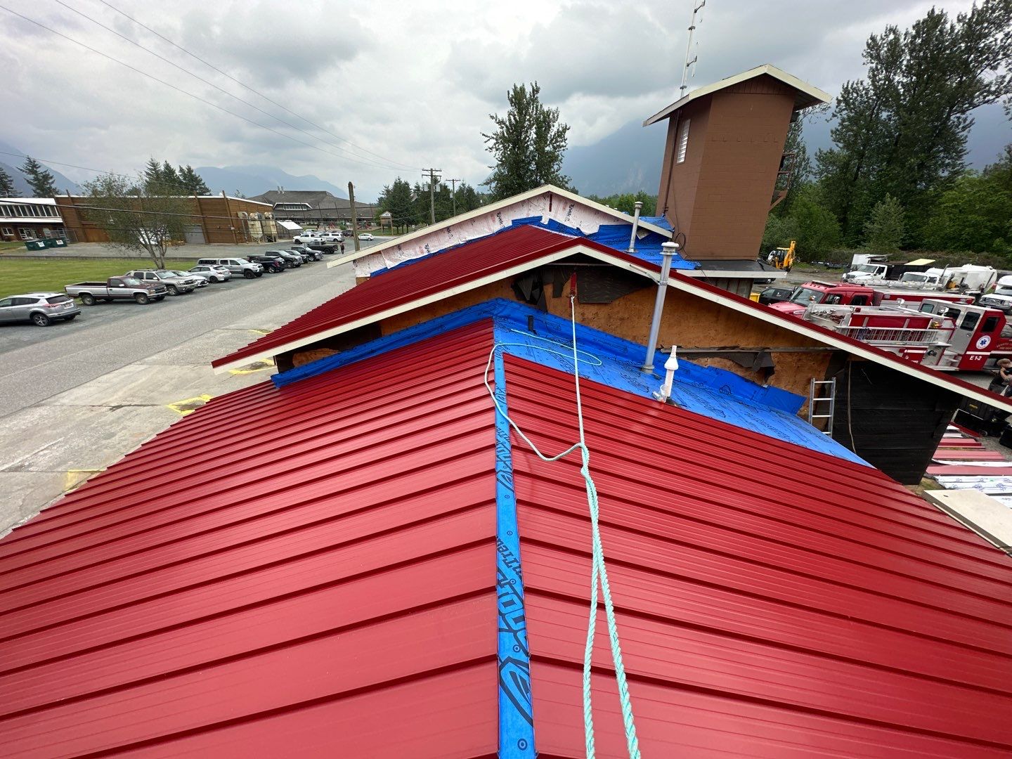 Commercial Roofing Installation using 12" Prolok metal  by Top Notch Roofing Inc