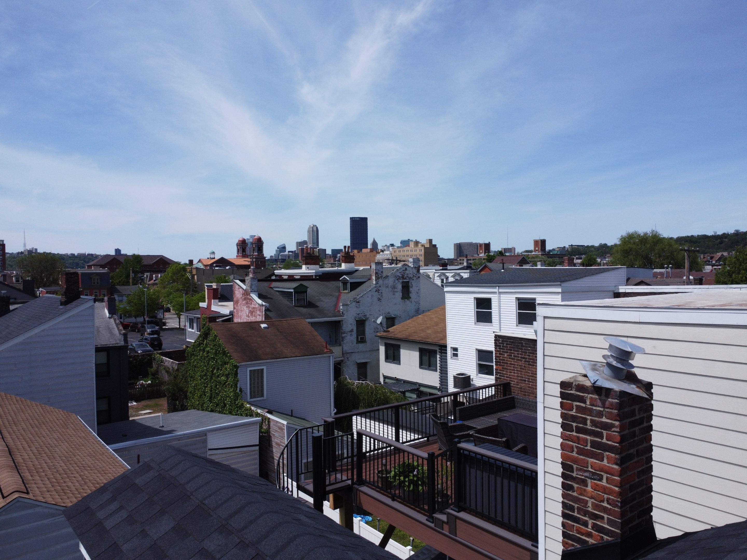 Elevated Multi-Level Composite Deck with Spiral Staircase in Pittsburgh by Cousins Roofing Siding & Decks