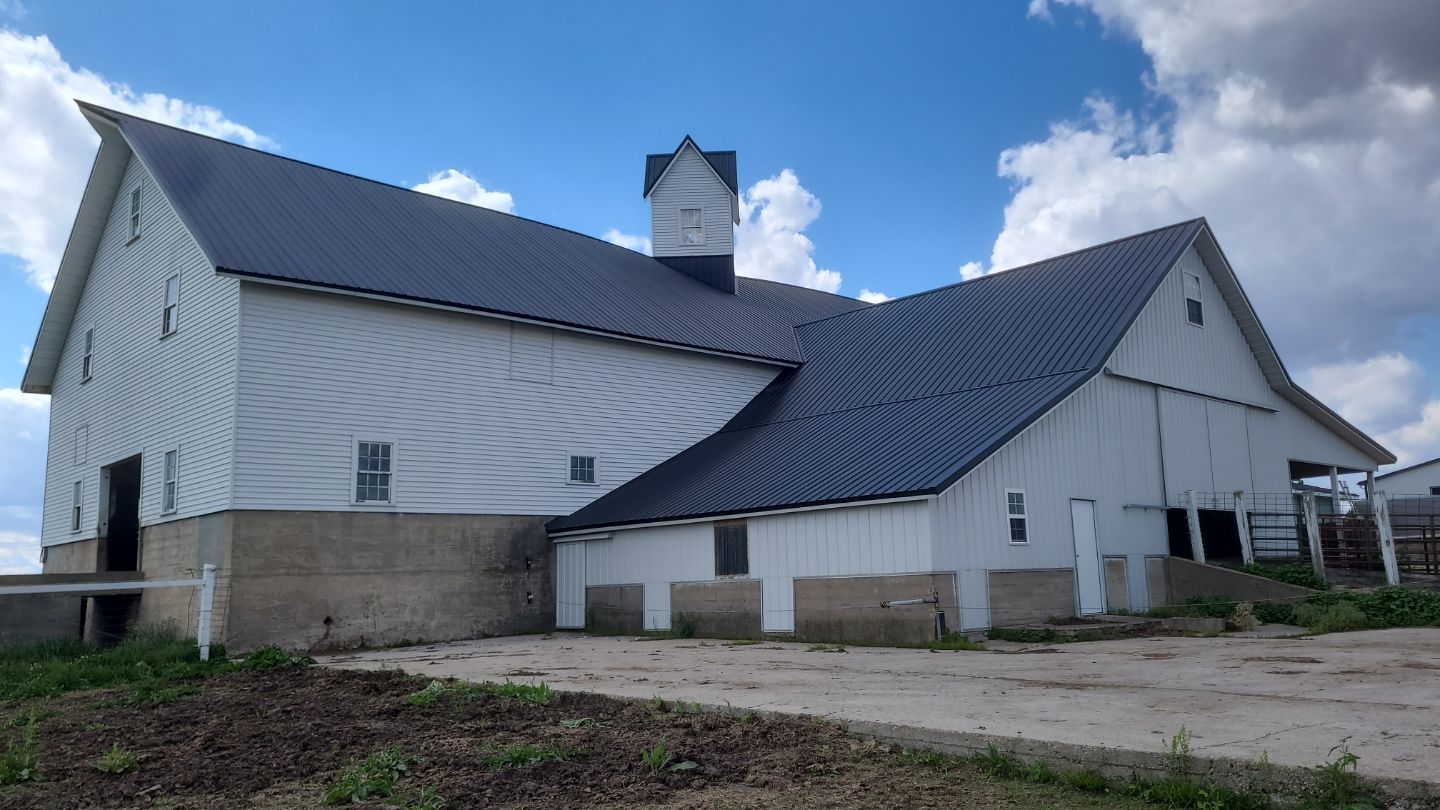 New metal roof on heirloom barn by Dagny Builders