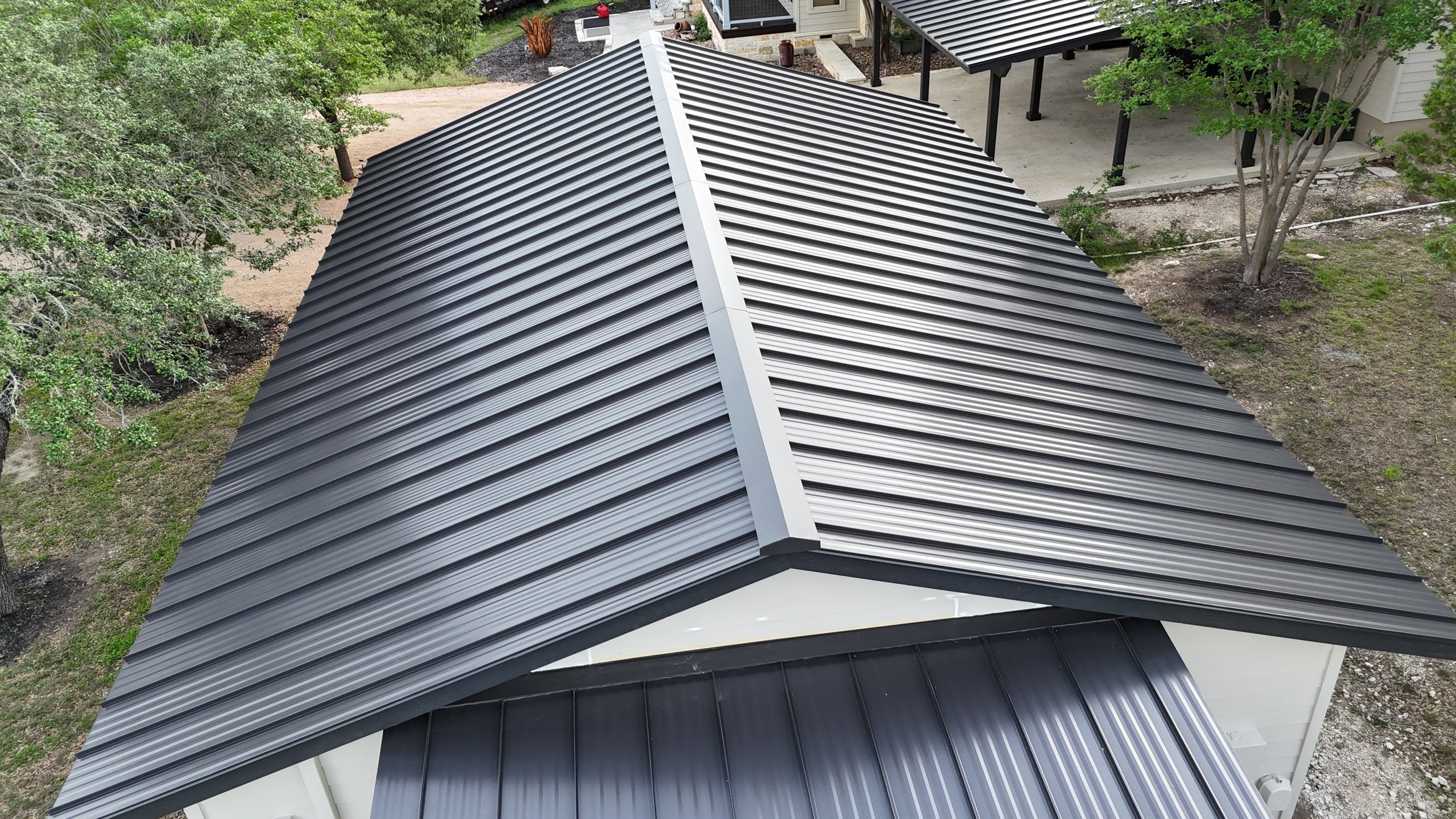 Dark Bronze Fully Striated panel by Wimberley Roofing
