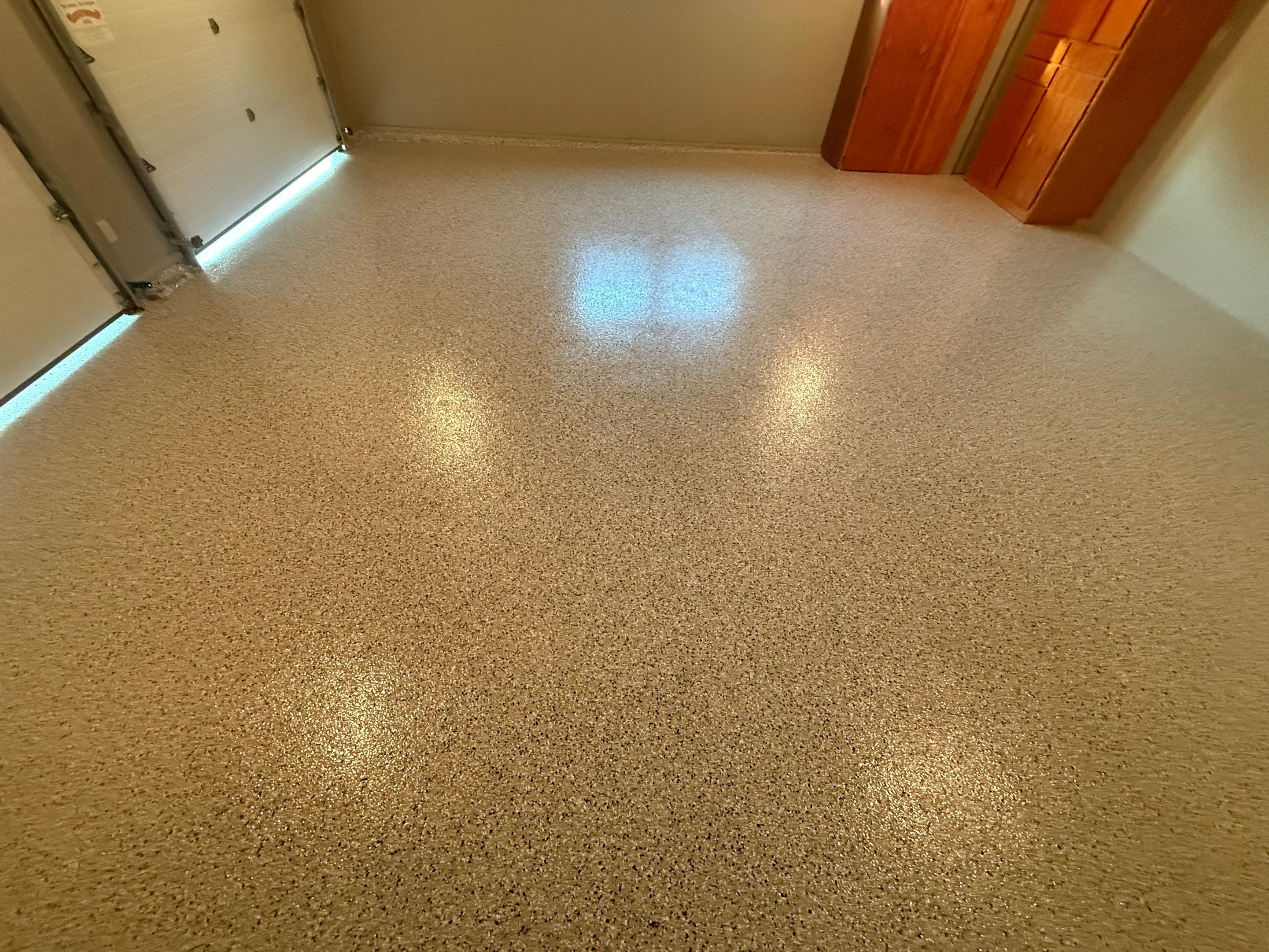 Cabin Fever Concrete Coating for Sioux Falls Garage by Select Painting, Coatings & Garage Cabinets