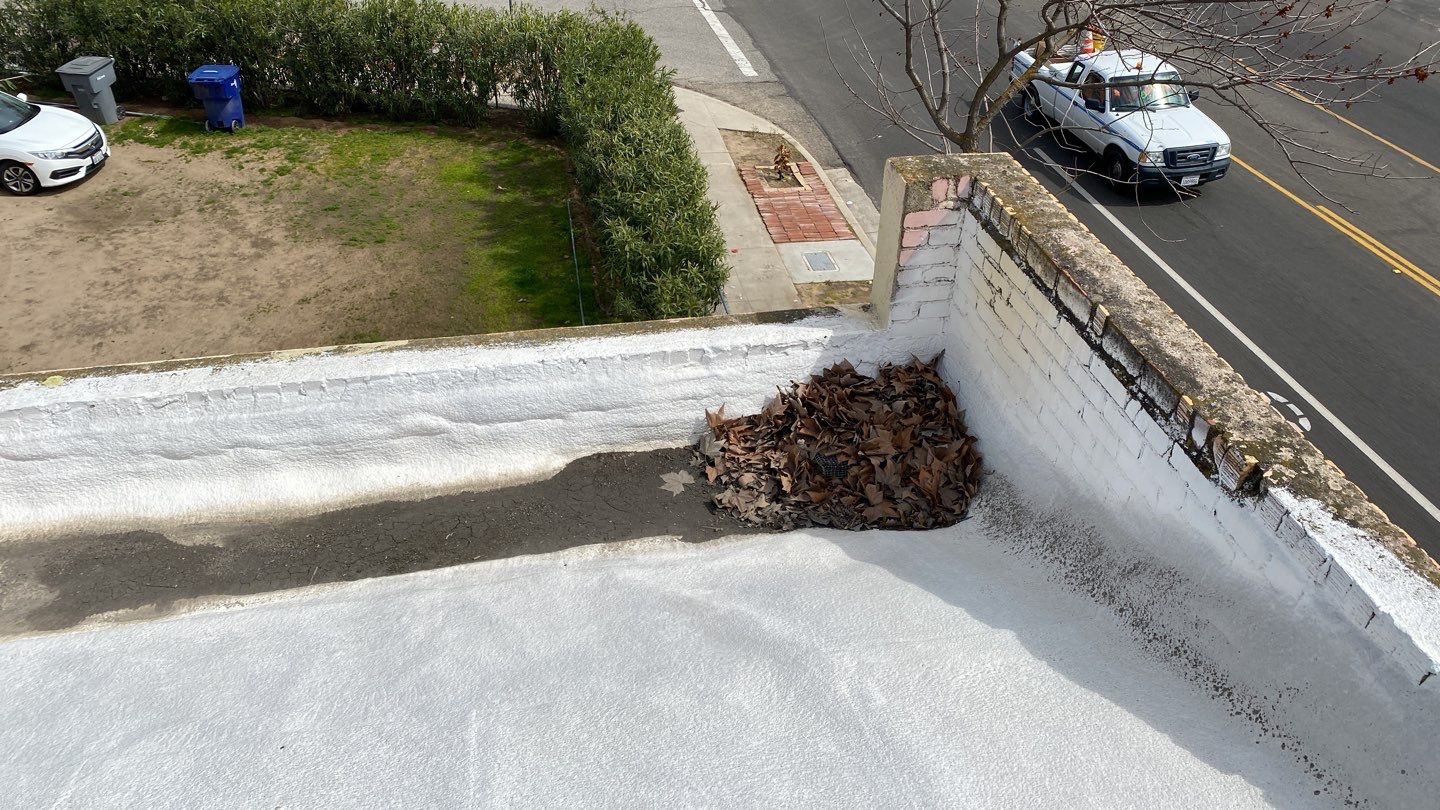 Polyurethane foam roof refurbish and recoating by Straight Edge Roofing Inc