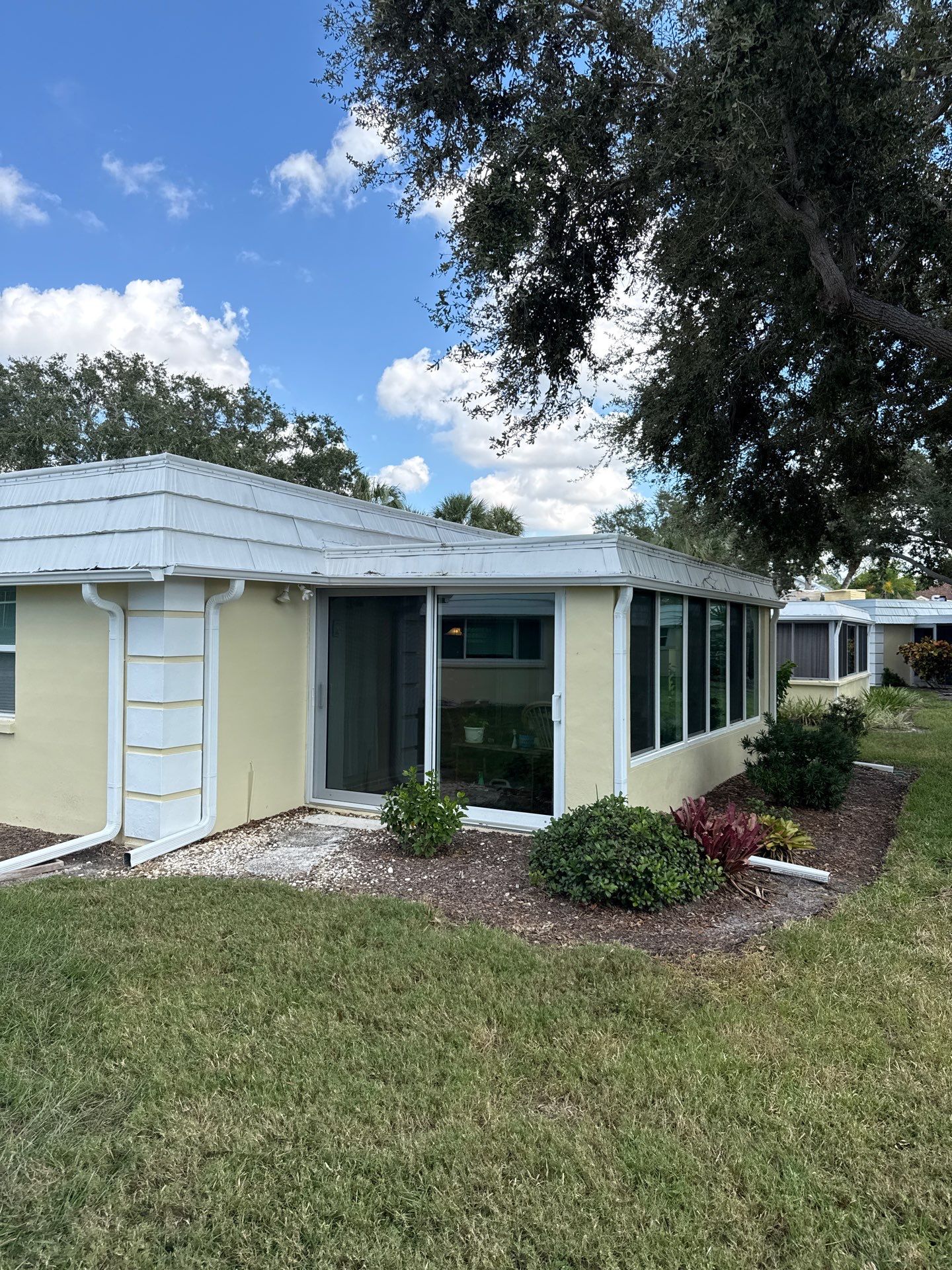 White Gutters and Matching Downspouts in Sarasota FL by Gutter Professors