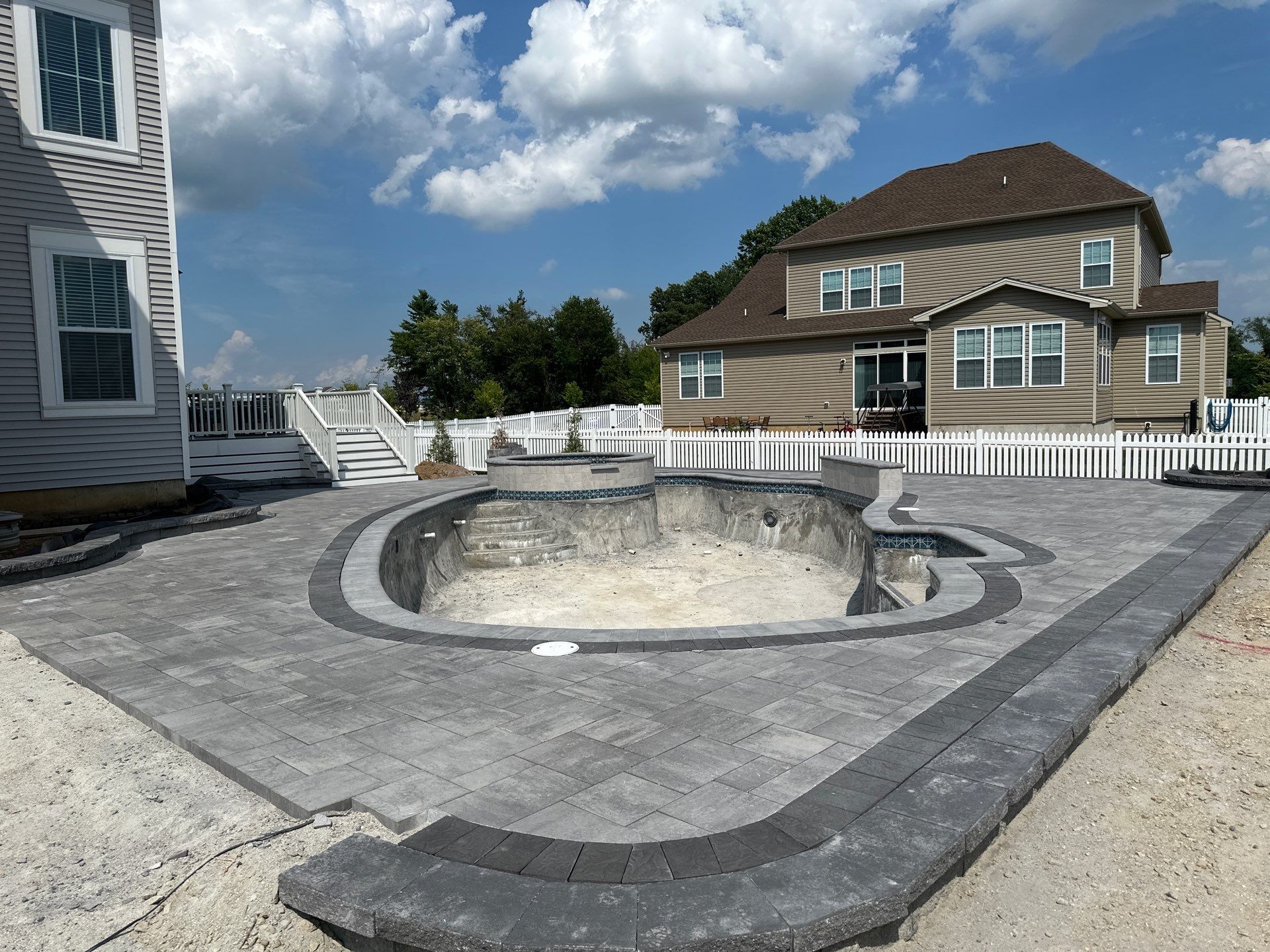 Pool and Hardscape Design in Delaware | Belgard Paver Patio & Outdoor Living Space by Studio G Indoor Spaces & Outdoor Living