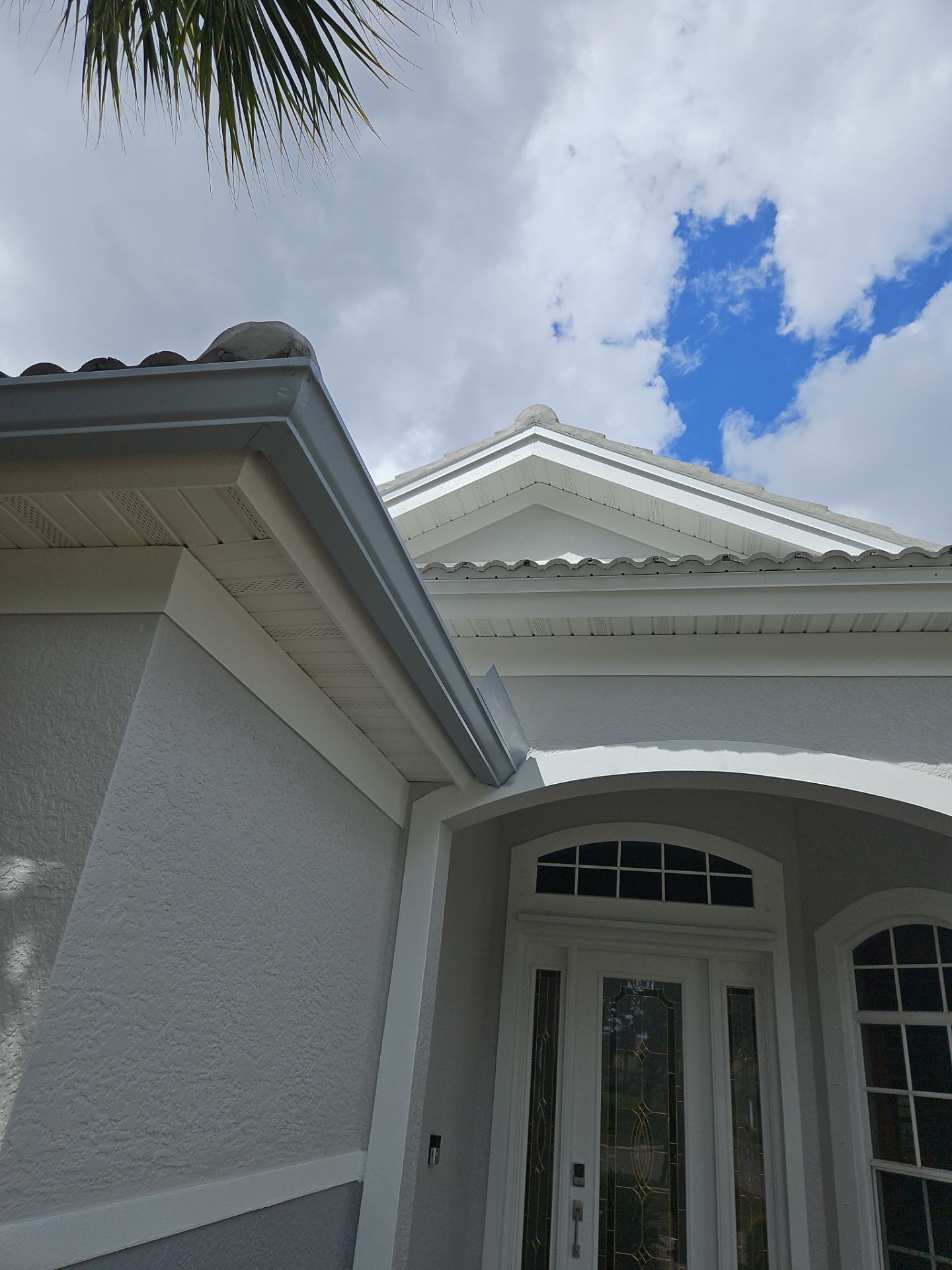 6-inch K-style Seamless Gutters and Splash Guard in Grey Color in Naples FL by Gutter Professors