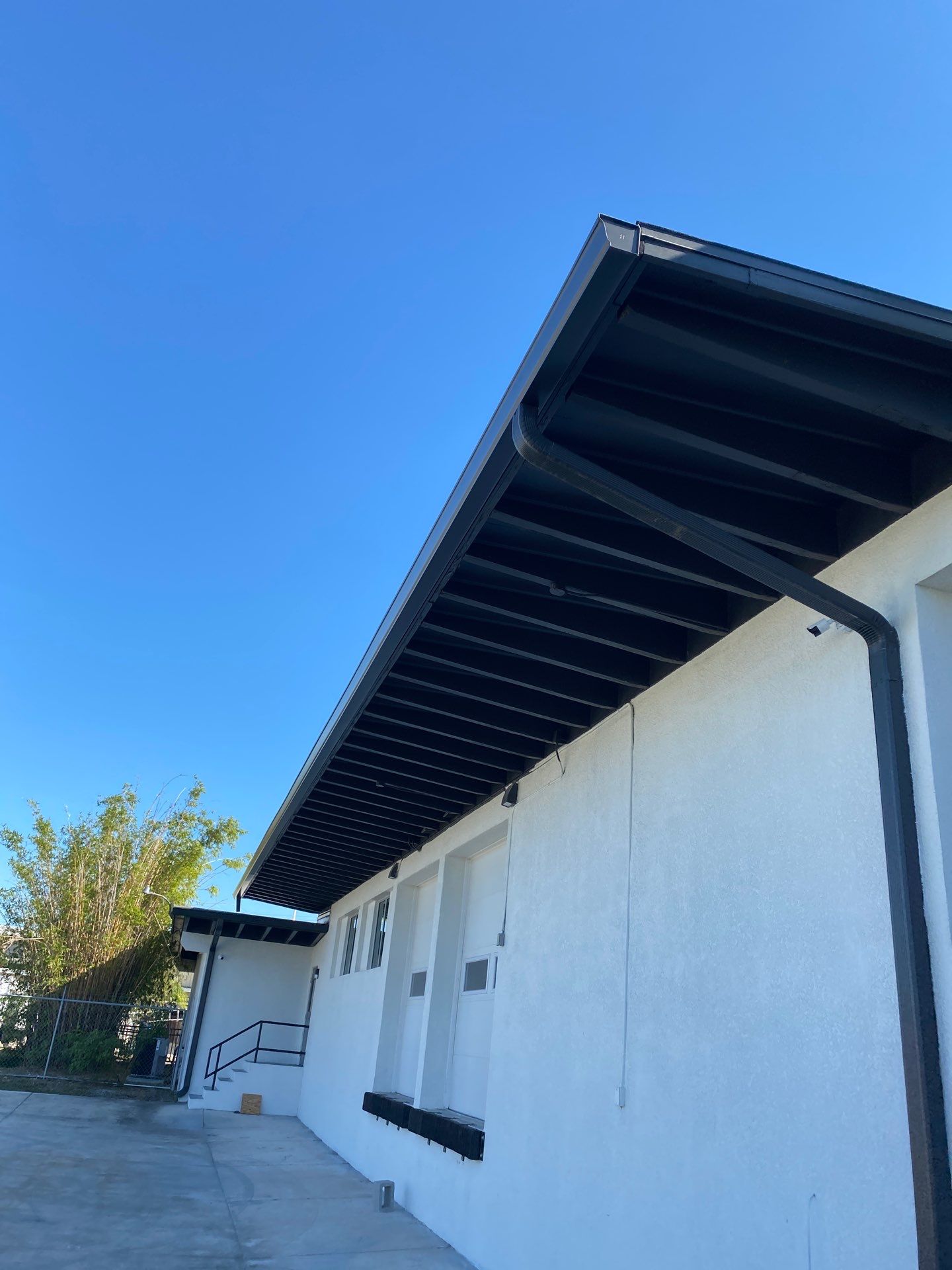 Black Seamless Gutters for Modern Homes in Sarasota FL by Gutter Professors
