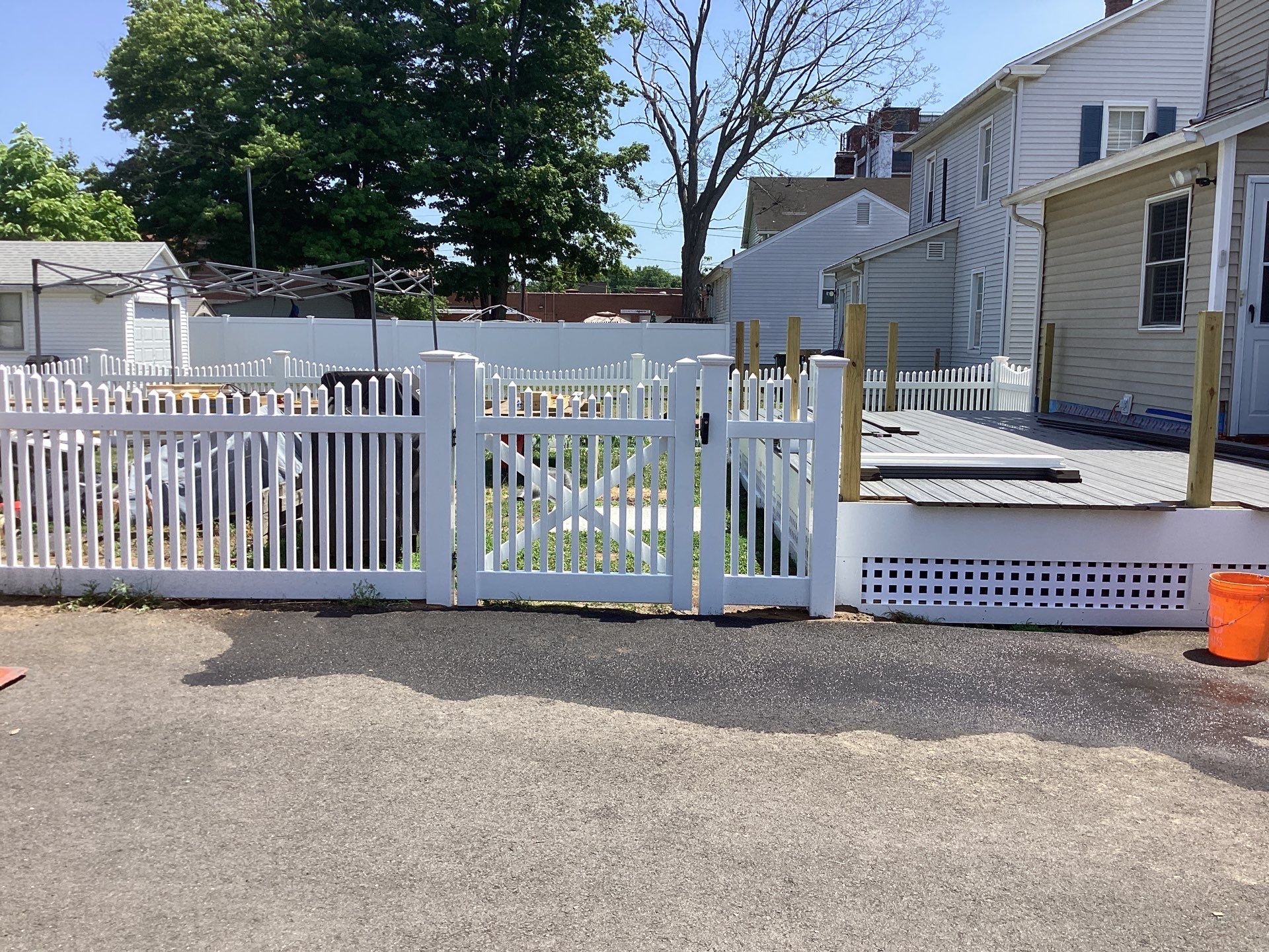 Fence replacement using White Vinyl picket with scalloped edge. by DiGiorgi Roofing and Siding Inc