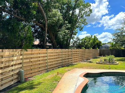 Wood Fence Installation using Horizontal Shadowbox Wood Privacy Fence