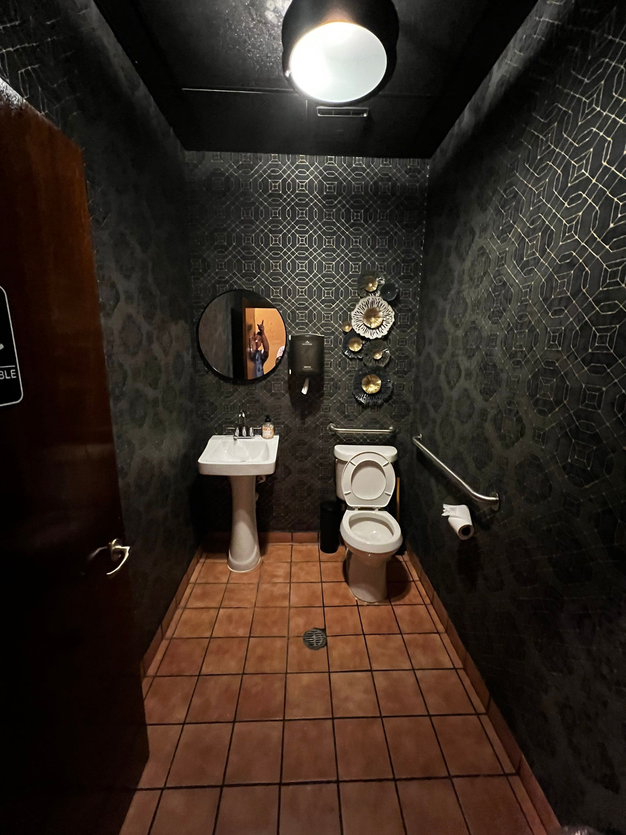 Commercial Restaurant Restroom Renovation Featuring Patterned Wallpaper in Smyrna by Swift Home Renovations