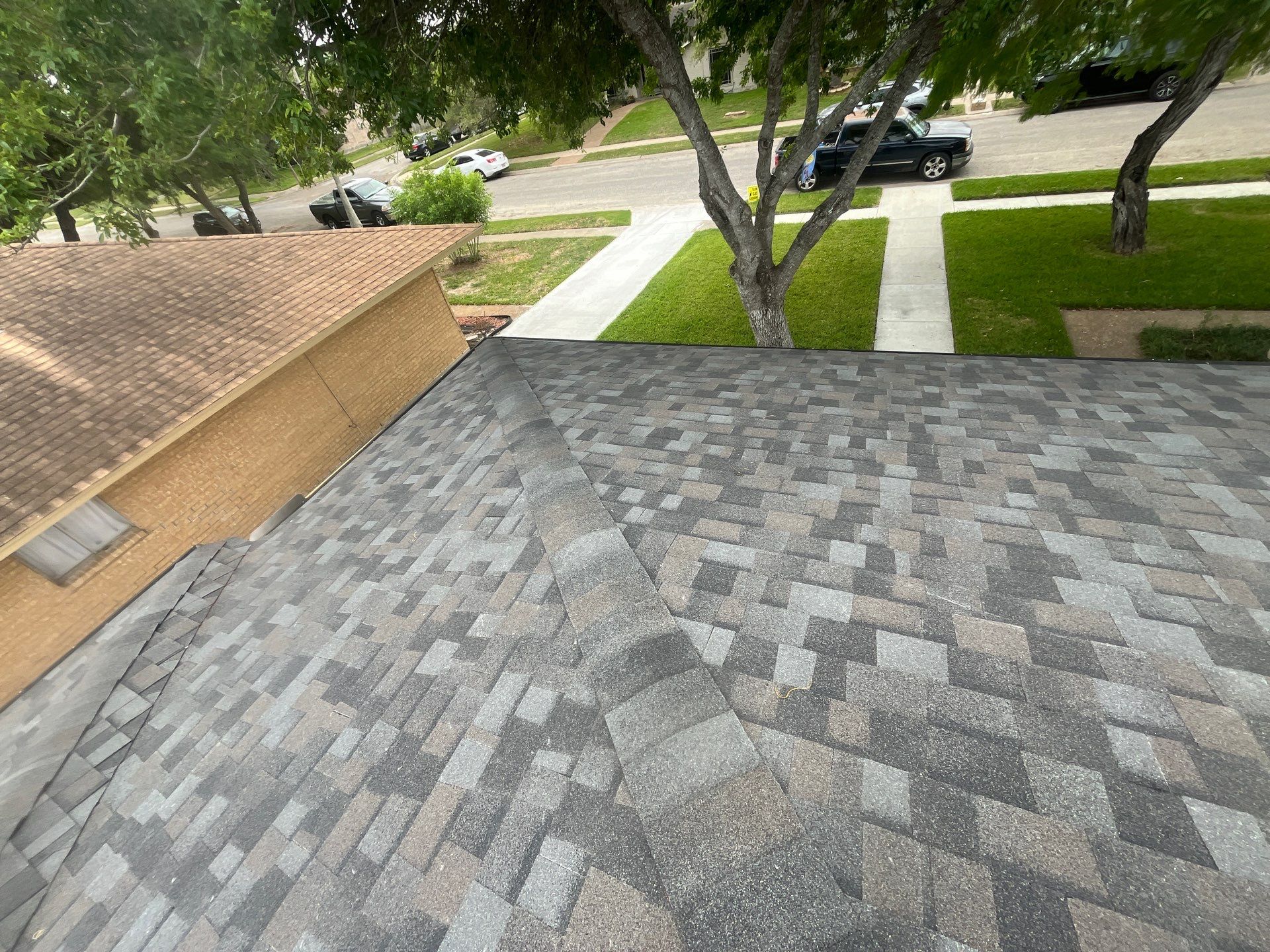 Colored Vinyl Windows to blend into brick by Bayfront Roofing and Construction