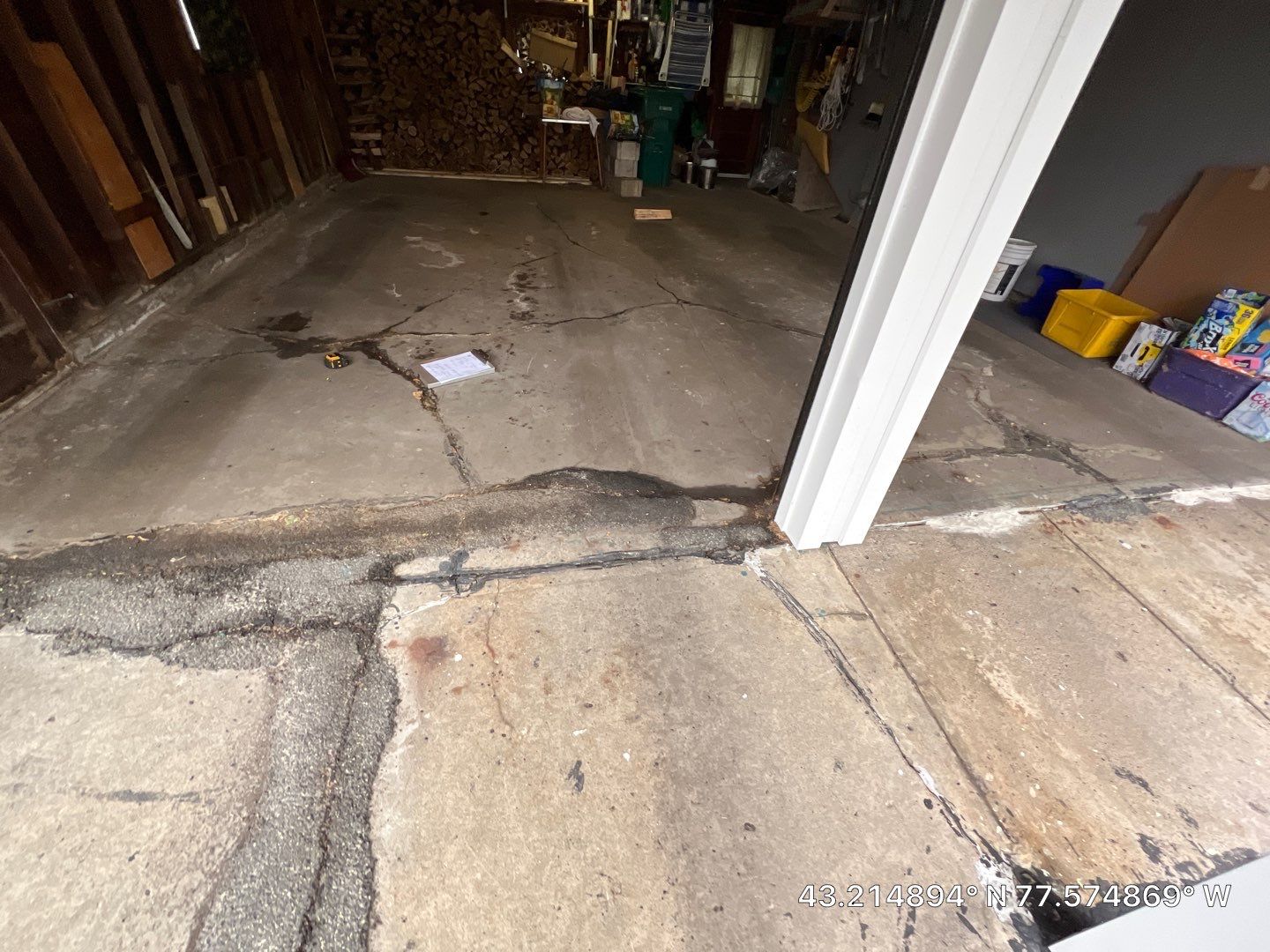 Concrete garage floor replacement with a broom finished apron and sidewalk  by NG Masonry & Construction LLC