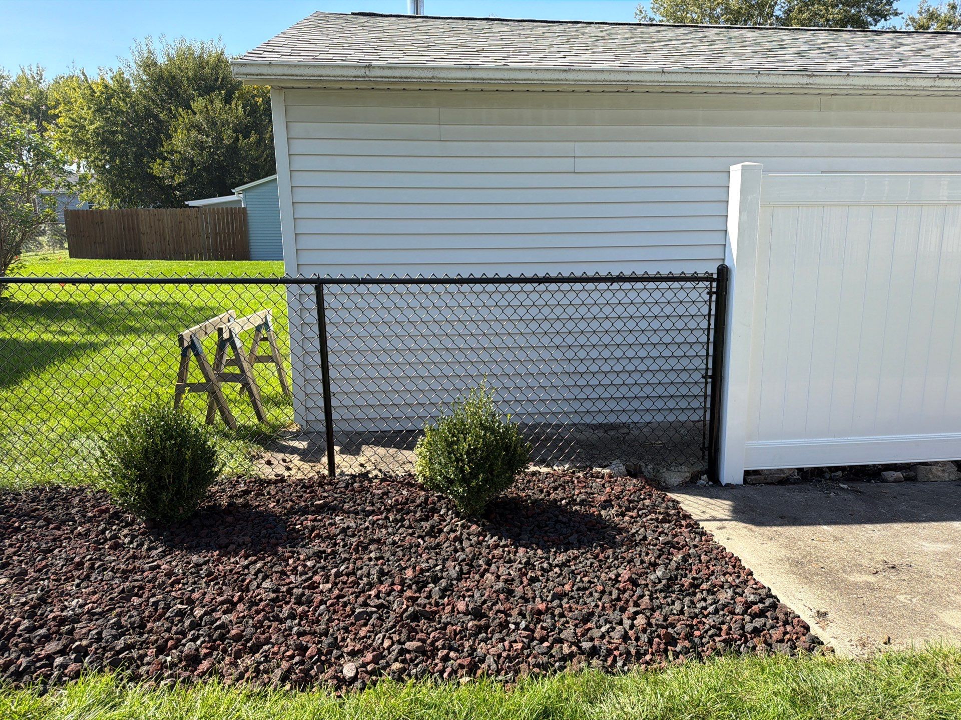 Custom Vinyl Privacy and Black Chain Link Fence Installation in Cedar Falls by Perfect Picket Fence and Stain