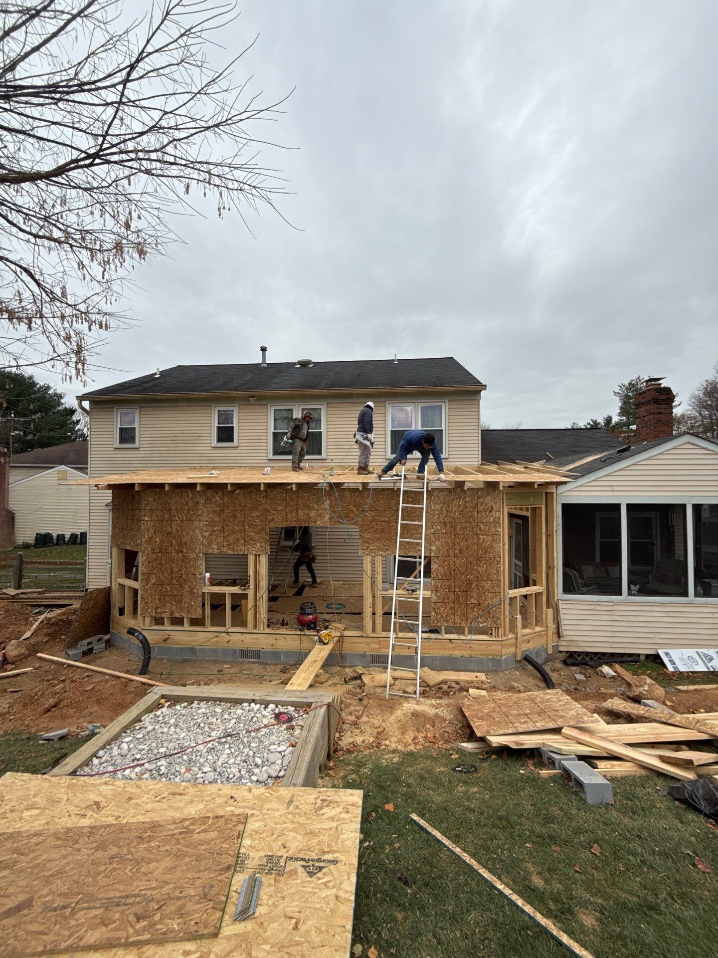 Sun room  using Concrete wood lumber, insulation , drywall, painting , cabinets , laminate floor  . by Jesus Master Handyman LLC 