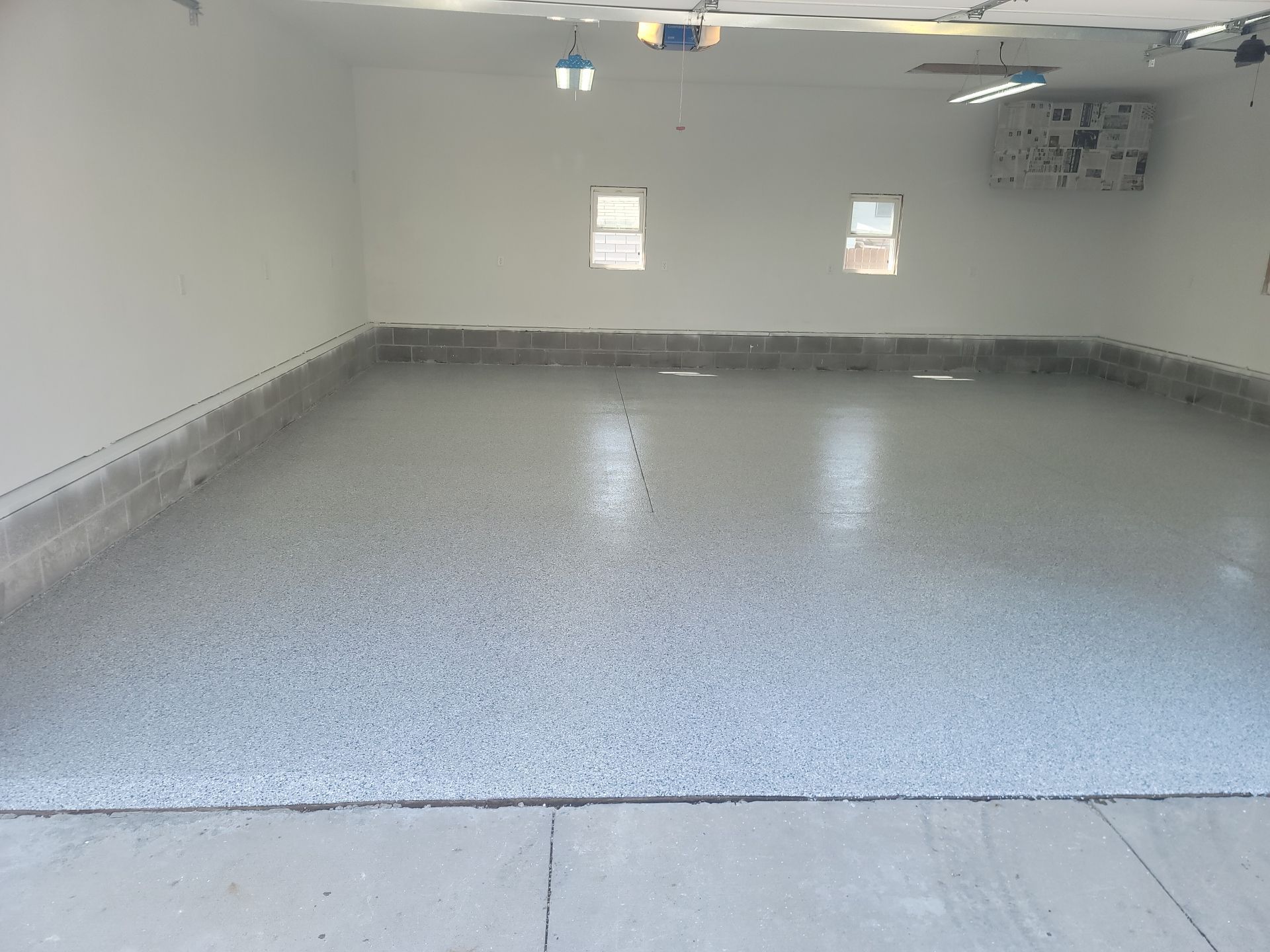 Flake Garage Floor Coating in Bondurant by Revival Concrete Coatings