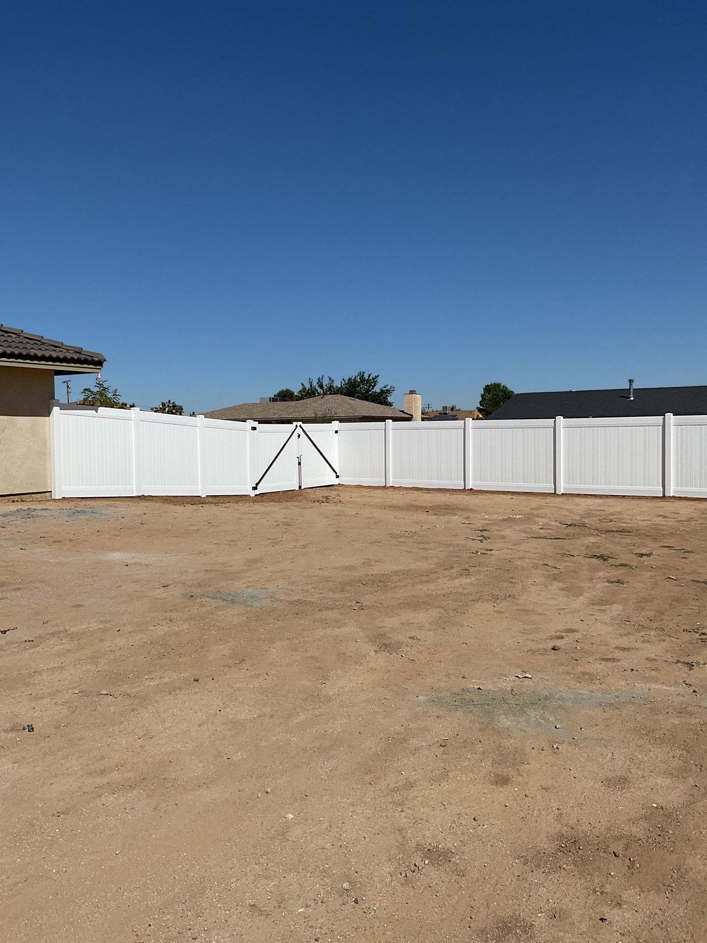 6ft White Privacy Vinyl Fence with Chain-link Fence by Fence Guys Inc.