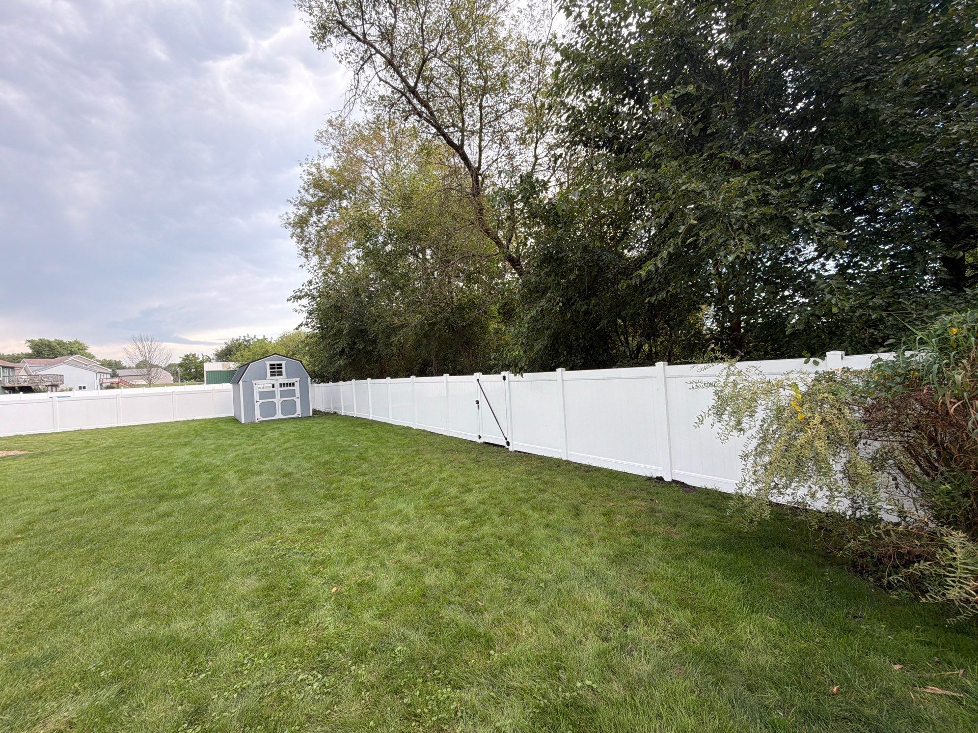 White Vinyl Privacy Fence Installation in Raymond, IA by Perfect Picket Fence and Stain