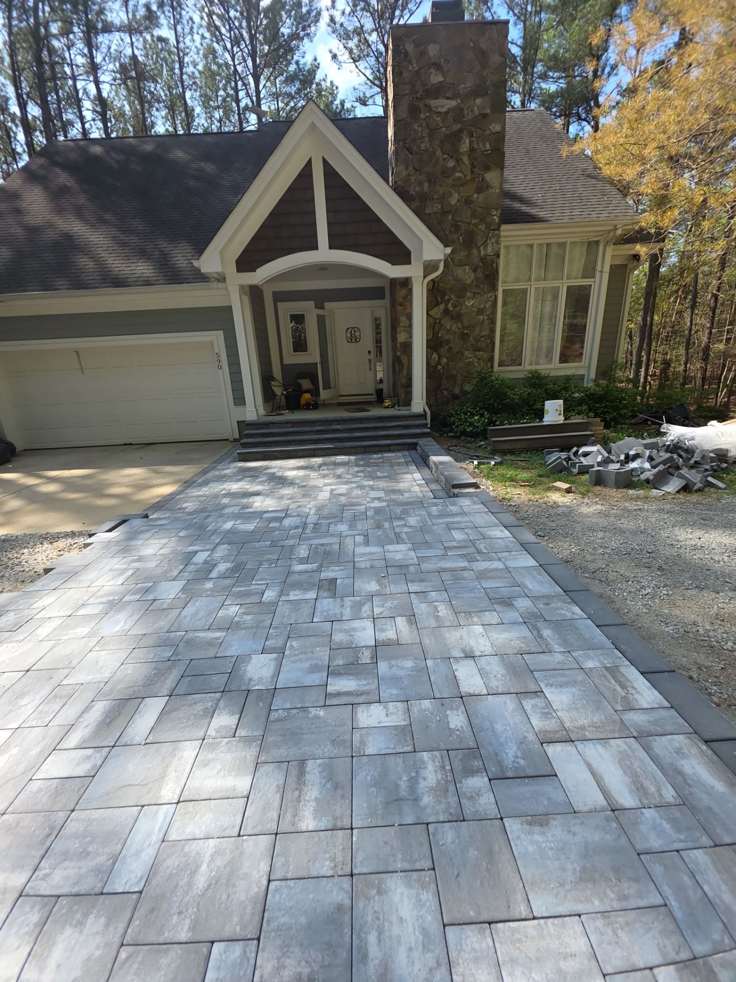 Pittsboro Outdoor Living Transformation – Retaining Wall, Paver Patio & Elevated Deck by Elite Remodeling and Design LLC