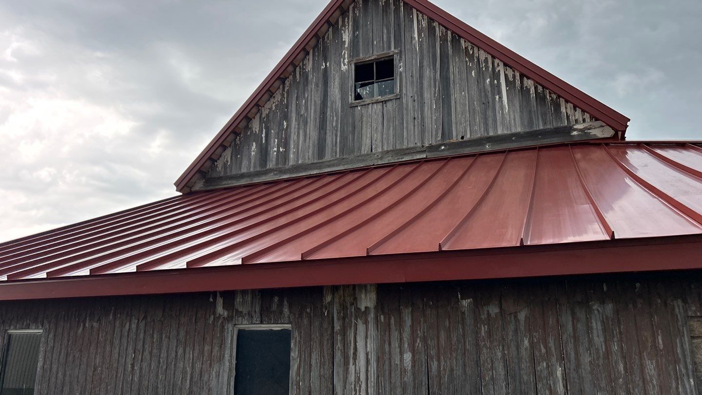 Residential Roofing Installation using Standing Seam Metal - Barn Red by RoofX 
