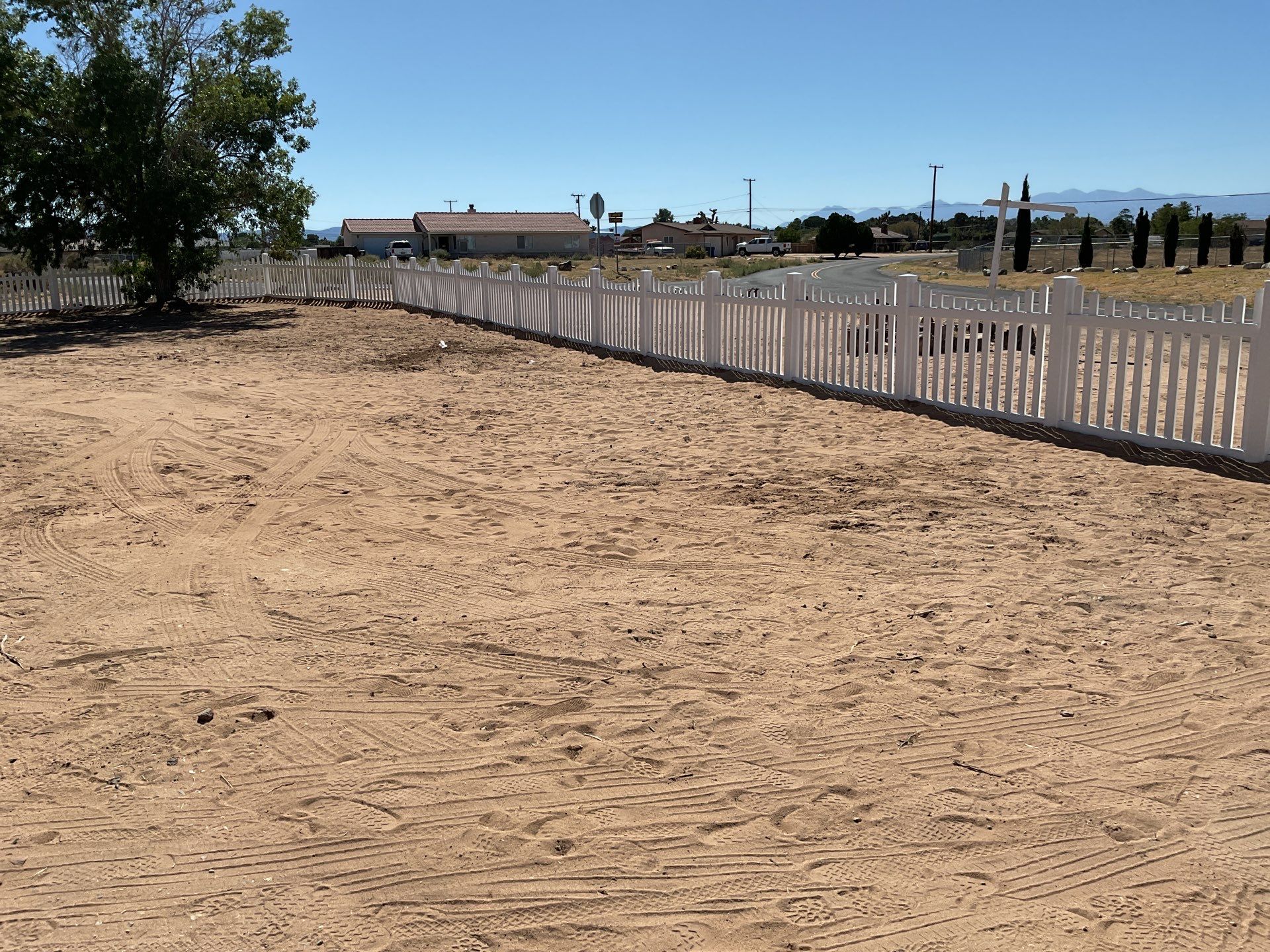White picket fence  by Fence Guys Inc. 