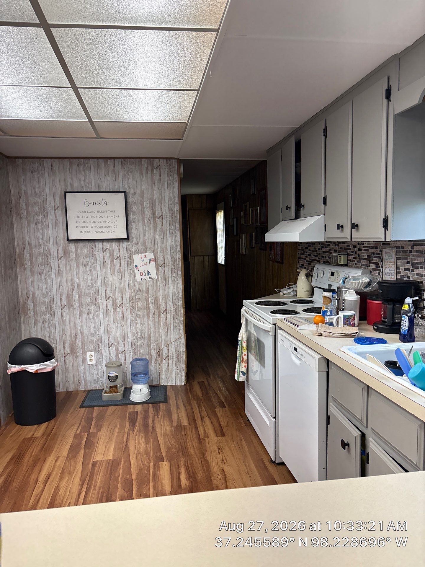 Kitchen Remodel Featuring Gray Cabinetry and Wood-Look Flooring by CompanyCam Sales Demo
