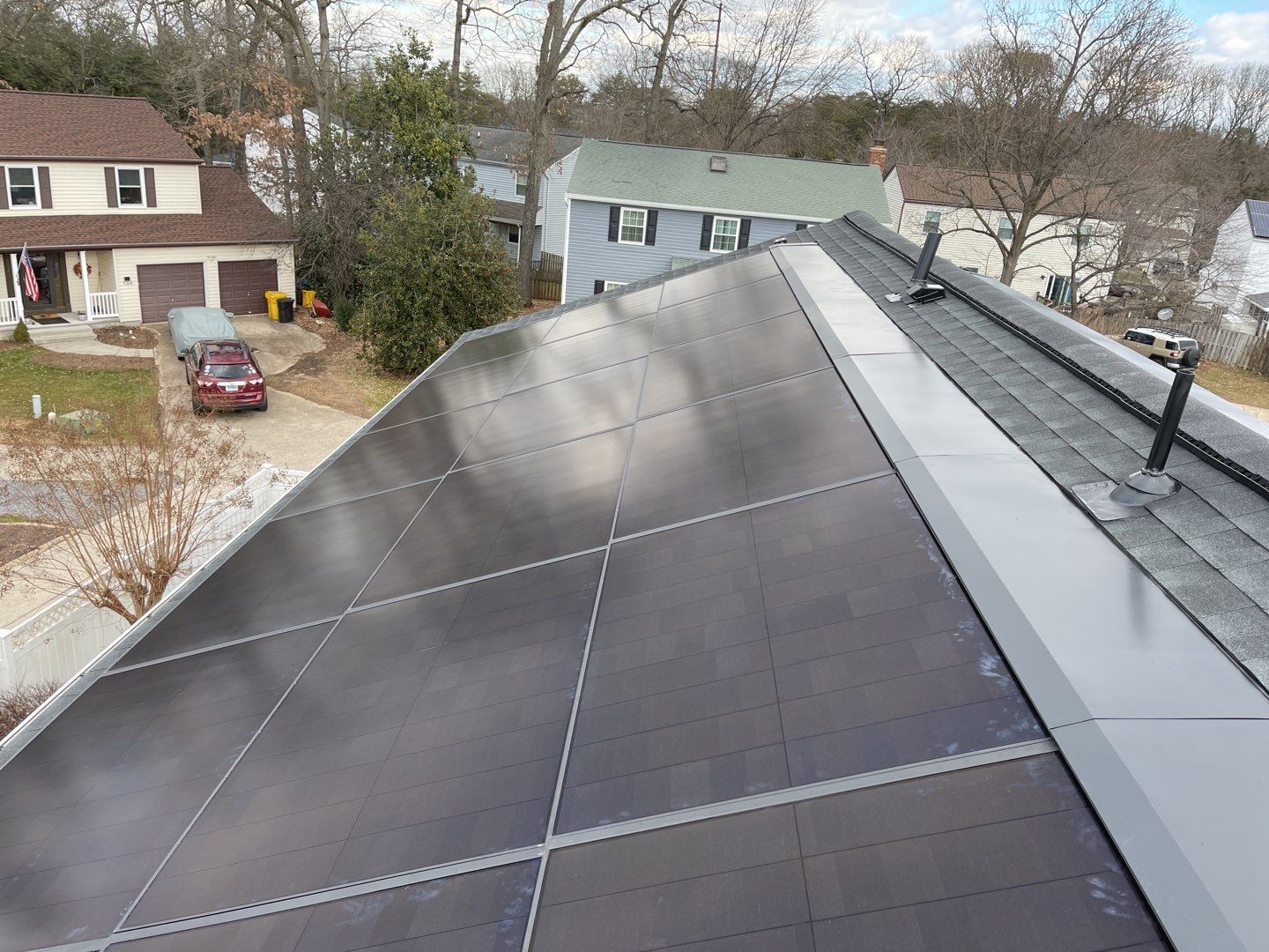 Roof Replacement with GAF Decotech integrated solar panels by American Home Contractors