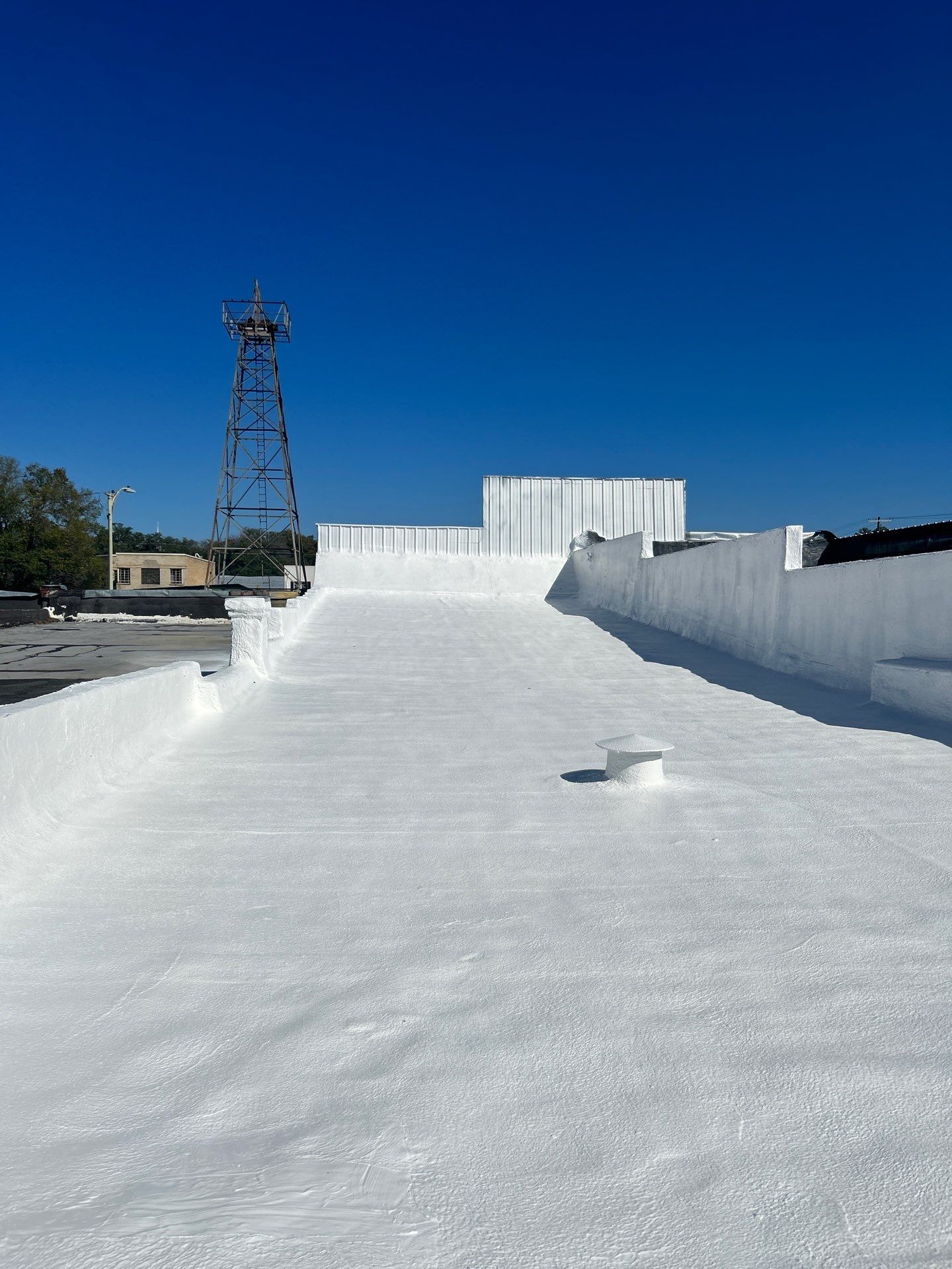 Downtown Gladewater Commercial Foam Roof Restoration – SPF + High-Tensile Acrylic by All Star Roofing LLC