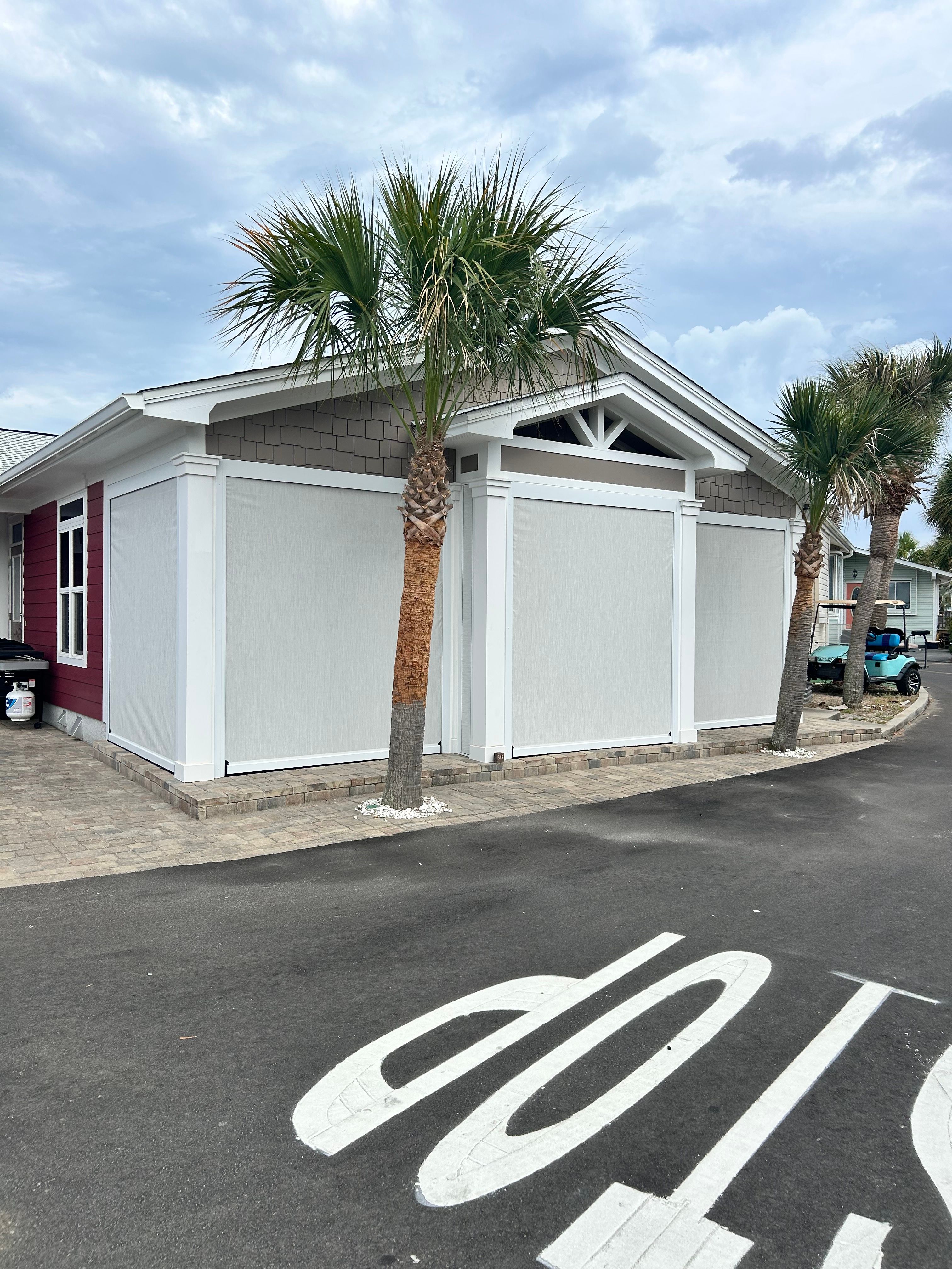 Fenetex Motorized Screen and Hurricane Shutter Installation in Panama City Beach by Brannan Aluminum Inc.