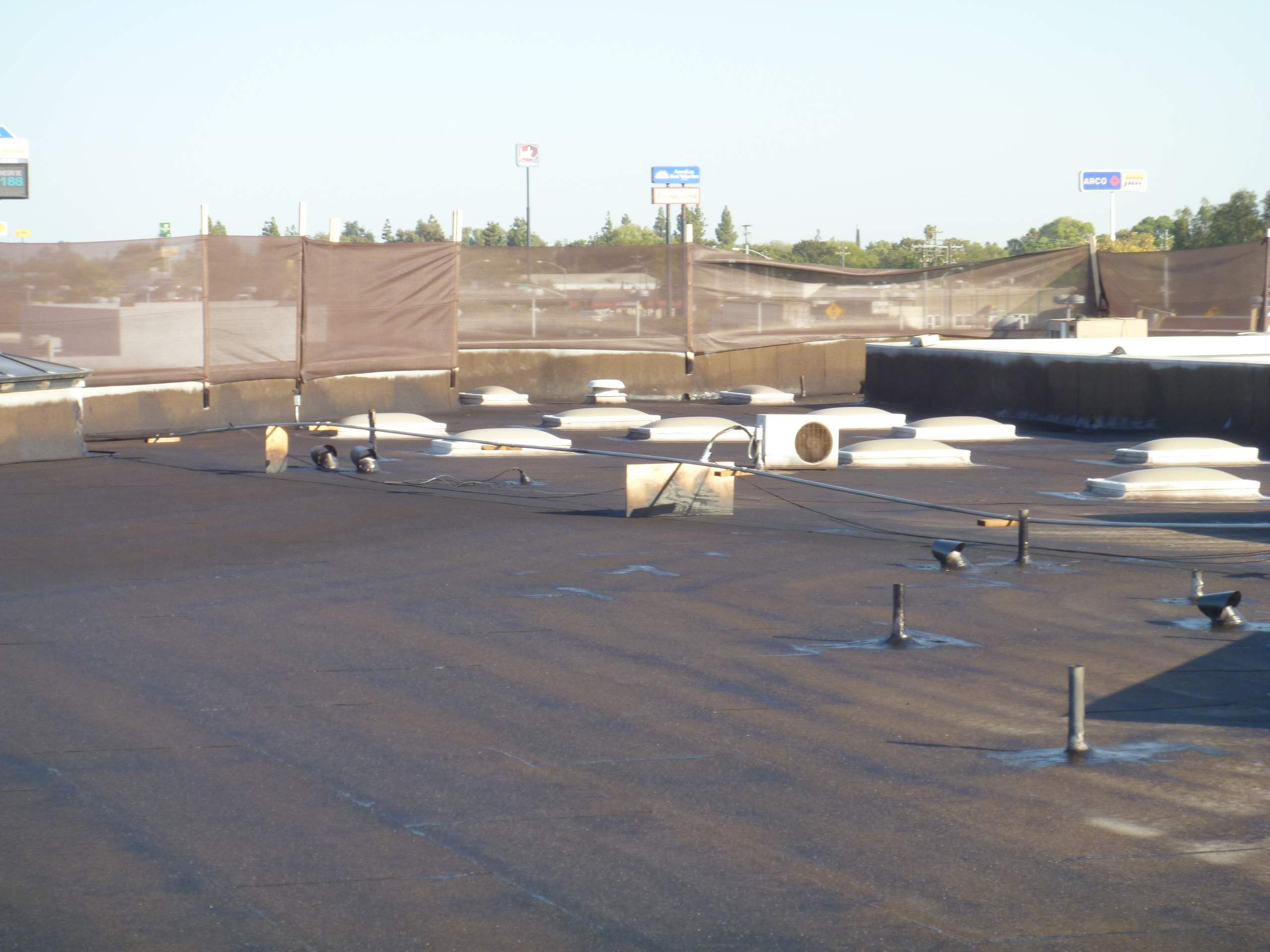 Commercial Roofing Installation using Spray foam and Conklin Benchmark/PUMA XL 18 yr warranty coatings by Straight Edge Roofing Inc