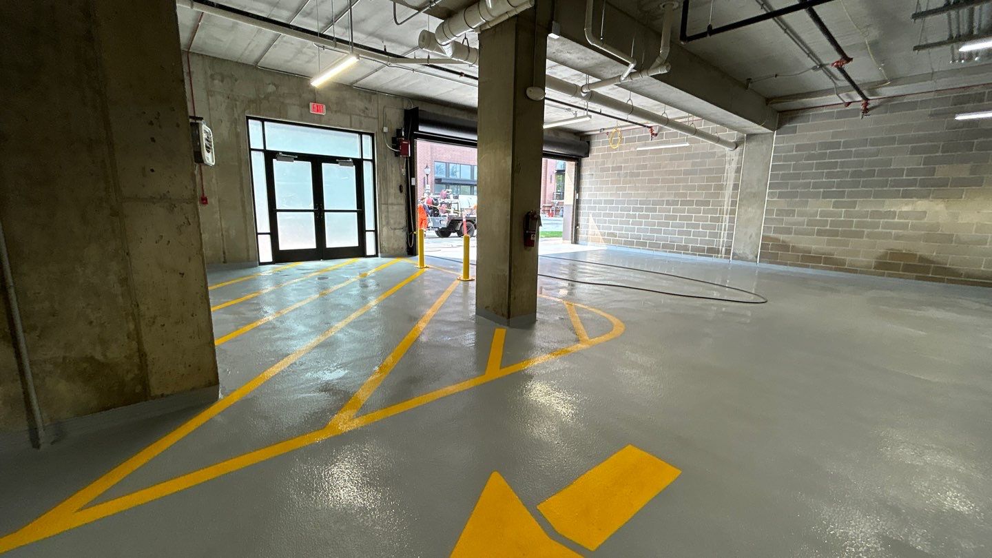 Parking garage using Hot water by Northern Power Washing LLC.