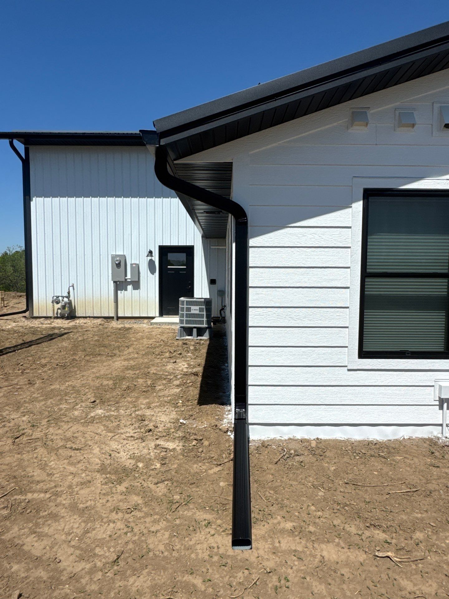 Black Gutter Installation + Snow Guards on Shouse by Next Level Seamless Gutters / Exteriors Inc.