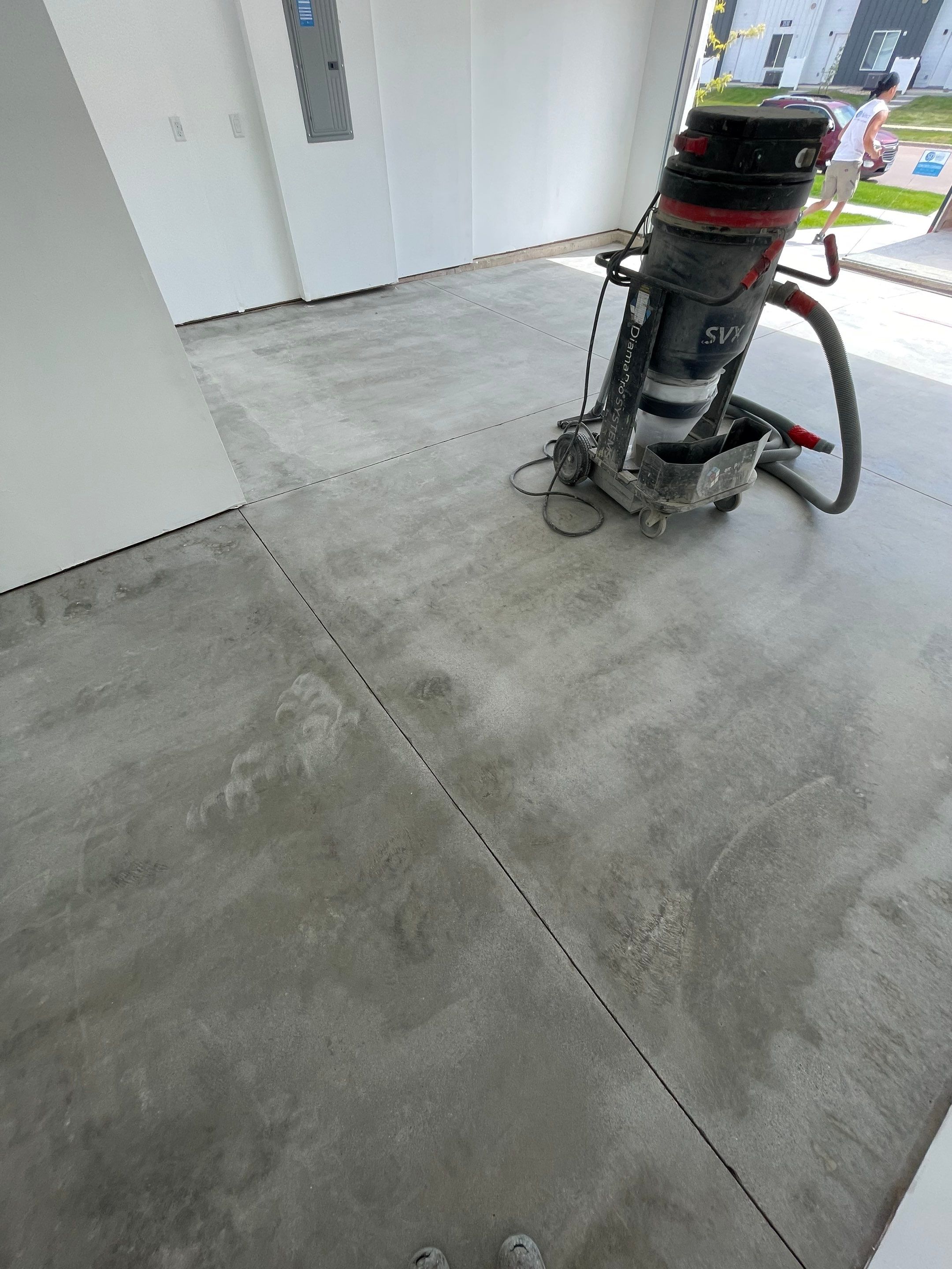 Sioux Falls Garage Floor Transformation with Cabin Fever Decorative Chips by Select Painting, Coatings & Garage Cabinets