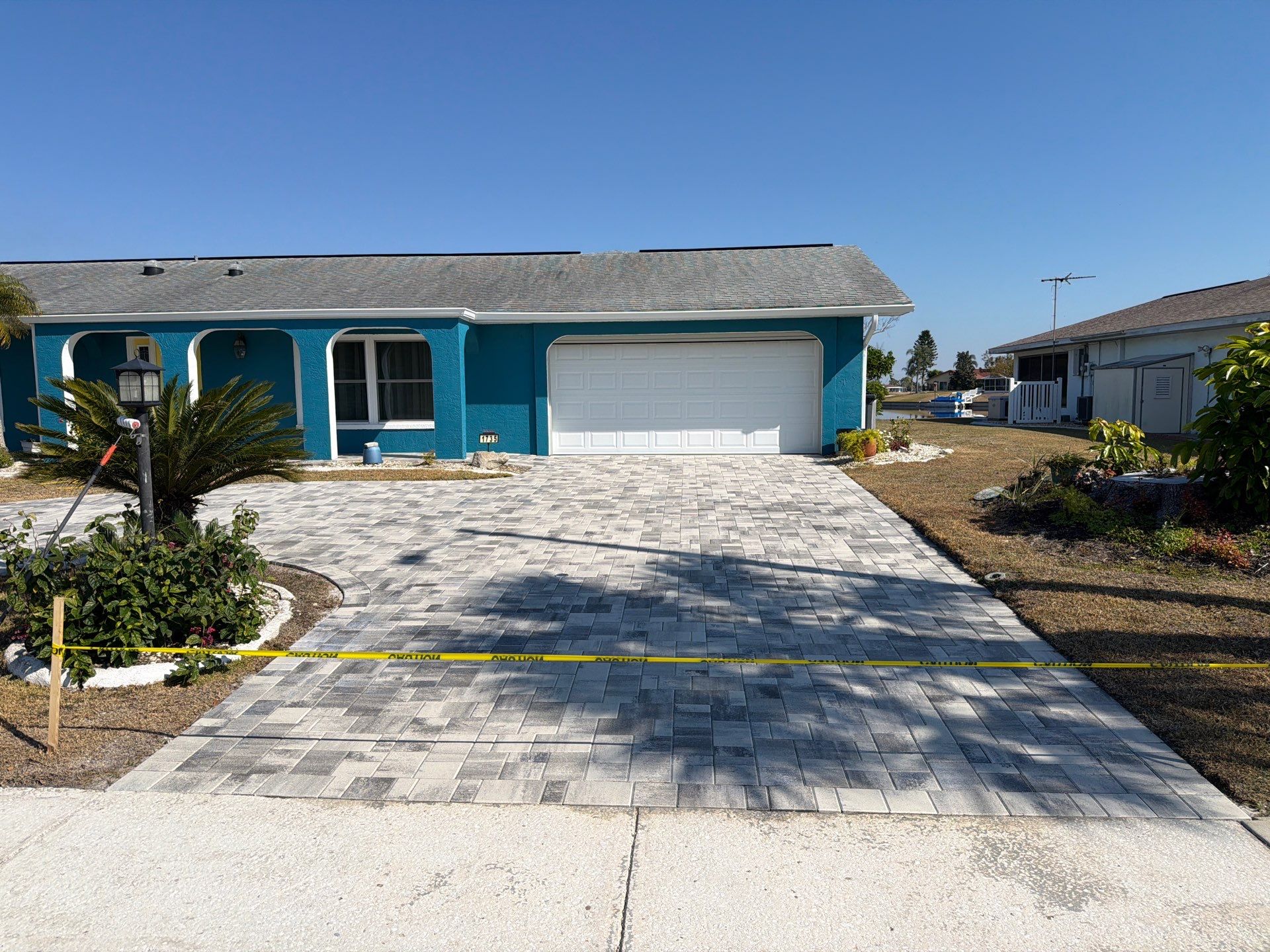 Modern Gray Paver Driveway and Entryway Walkway in Sun City Center by Supreme Paver Experts