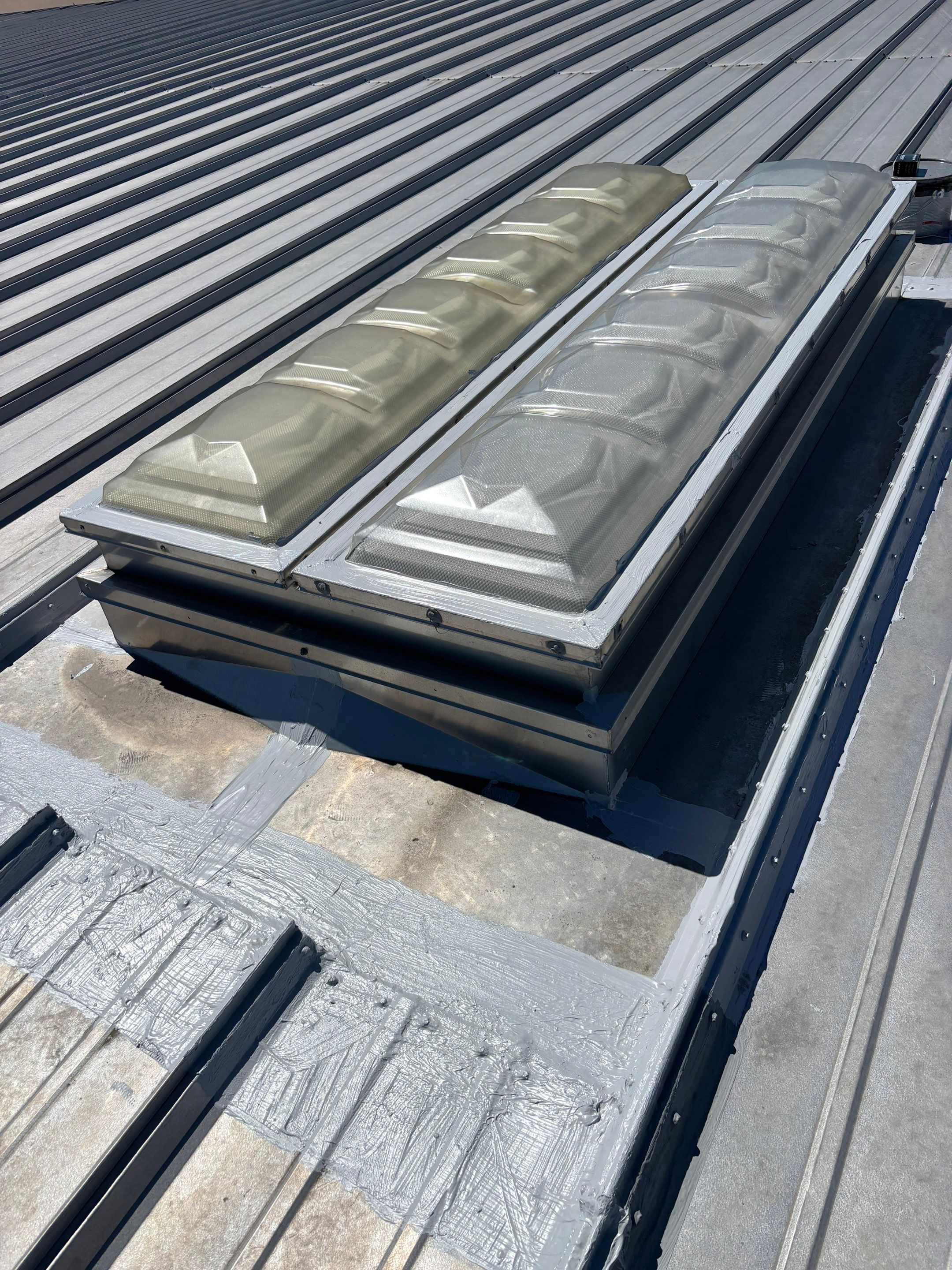 Commercial Metal Roof Repair and Skylight Sealing in West Memphis by Revival Roofing Services