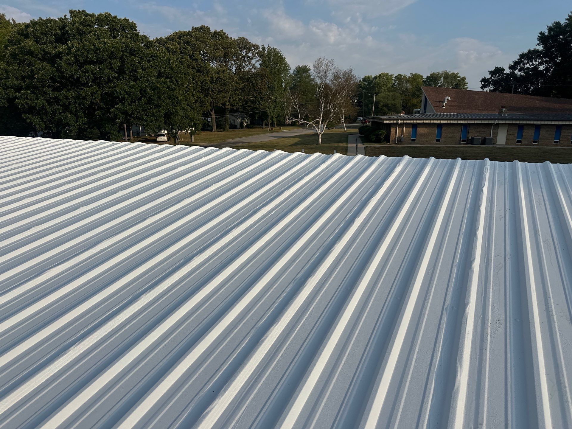 Commercial Roofing Install - Metal Coatings Restoration System  - Color White  by Titan Commercial & Residential Roofing 