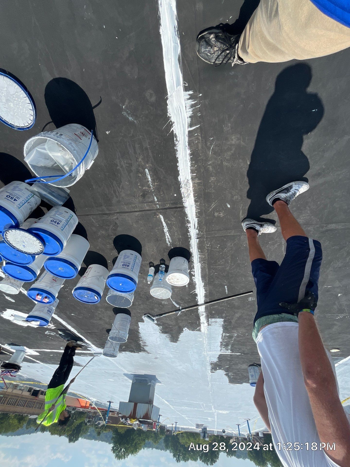 Commercial Roofing Installation using smartcoat Roof coating by Fahey Roofing + Contracting
