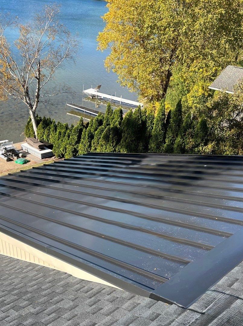 New Shingle Roof with Metal roof accents by Bloomfield Construction & Restoration
